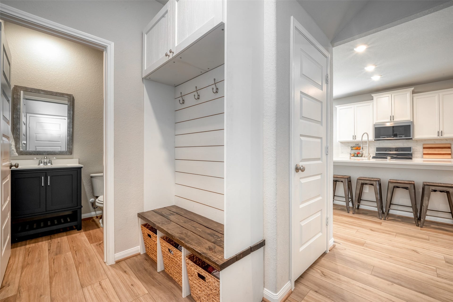 2321 W Winding Pines Drive, Tomball, TX 77375 This custom mud-room area is perfect for a drop zone as you enter from the garage. It also includes extra storage above and beneath the bench.