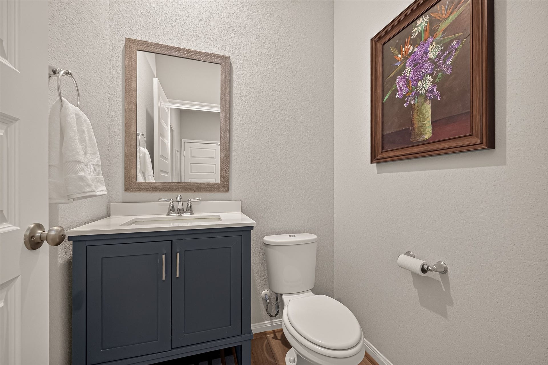 2321 W Winding Pines Drive, Tomball, TX 77375 Half bath conveniently located downstairs with upgraded mirror and sink.
