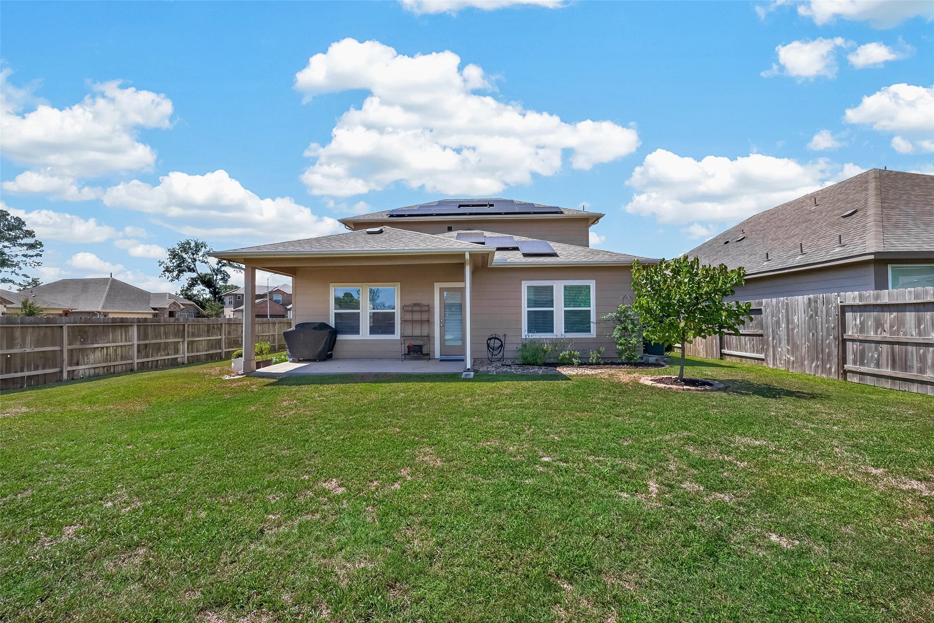 2321 W Winding Pines Drive, Tomball, TX 77375 The covered porch is a nice place to spend some time outdoors.