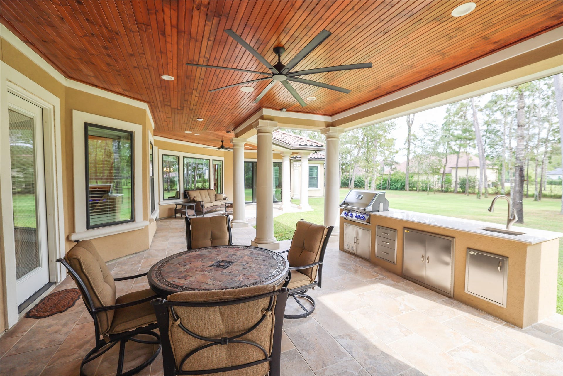 6310 N Lazy Meadow Way, Spring, TX 77386 Large patio with outdoor kitchen.
