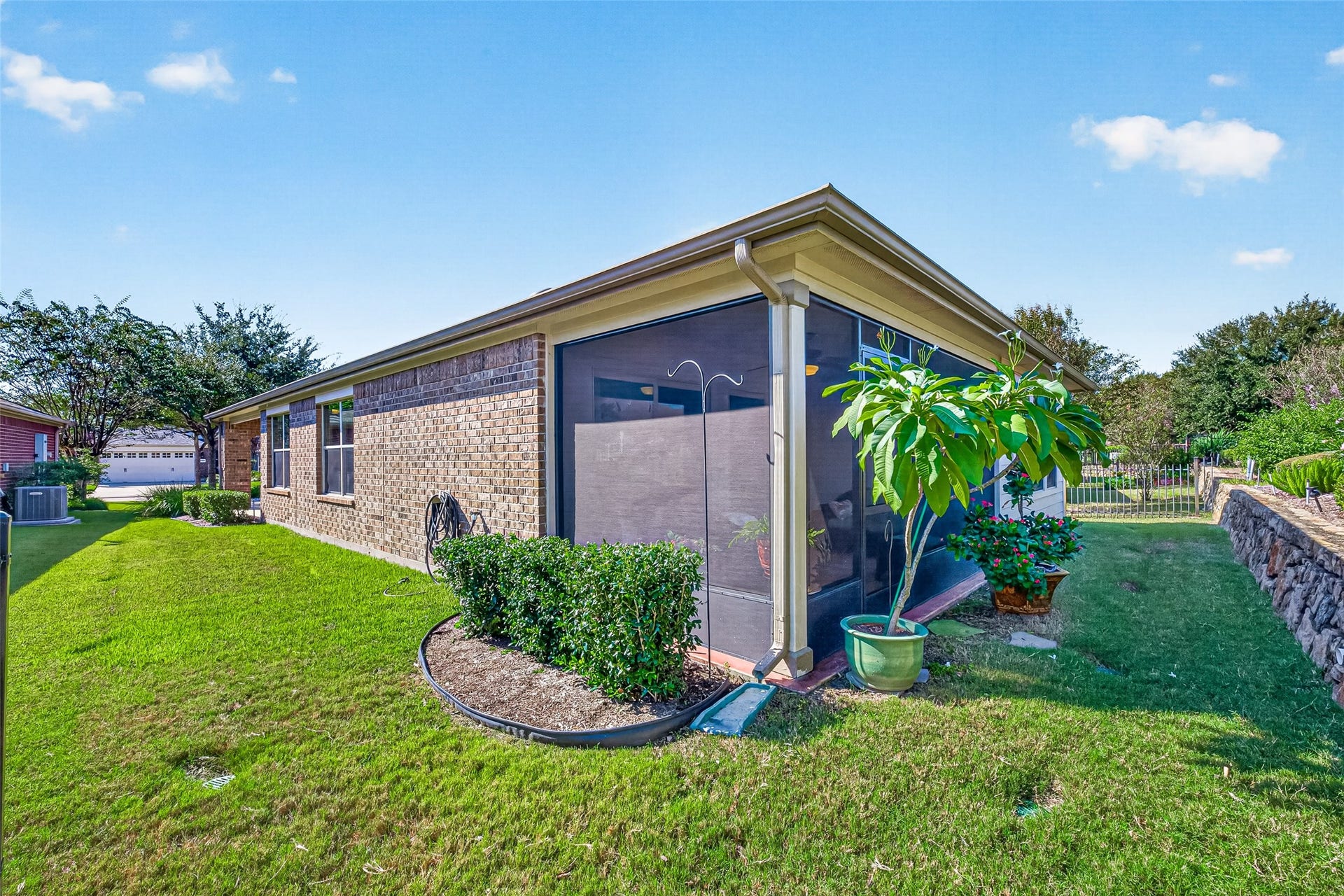 1126 Oleander Way, Richmond, TX 77469 Charming rear exterior surrounded by well-kept landscaping.
