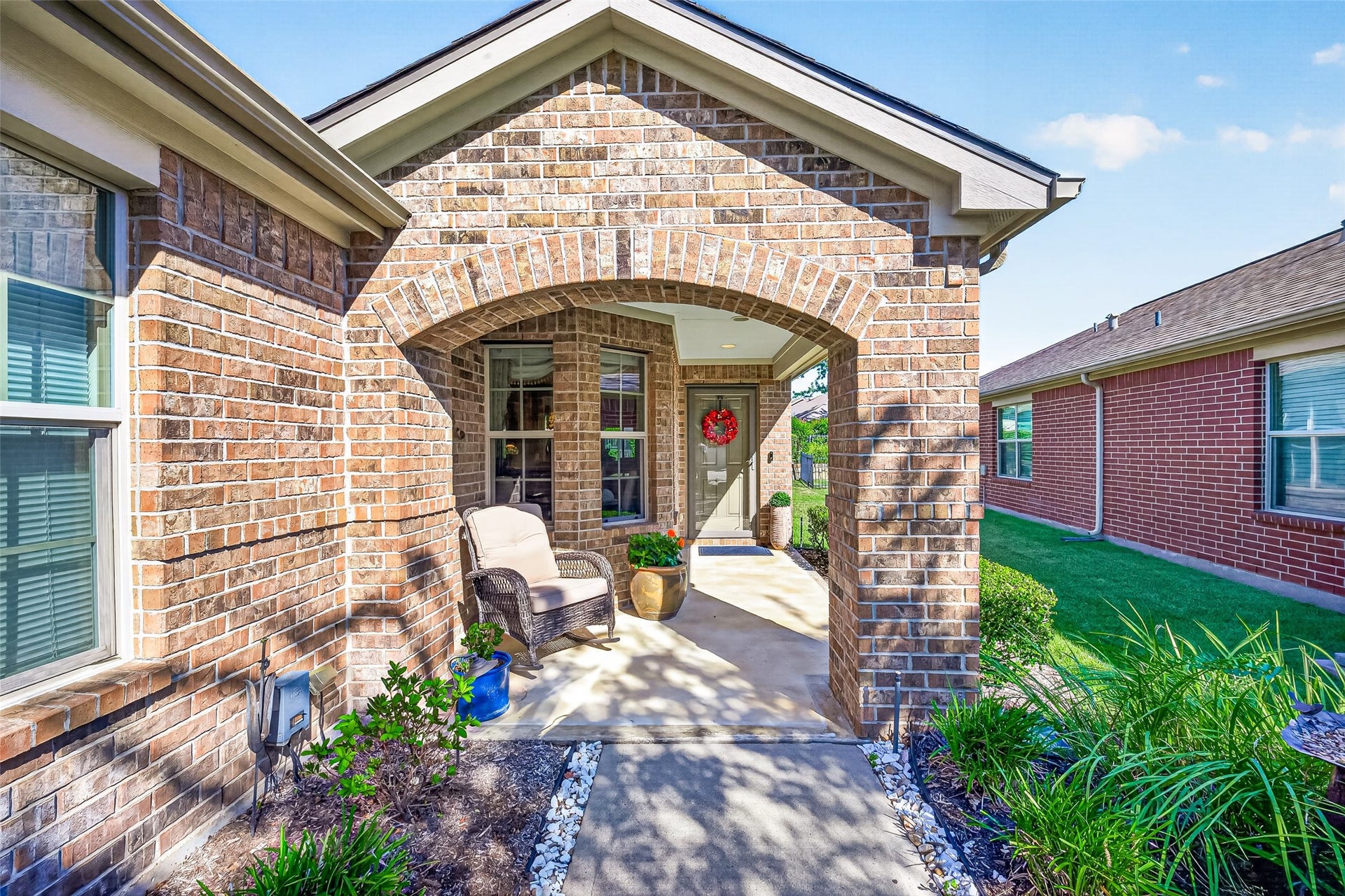 1126 Oleander Way, Richmond, TX 77469 A charming arched entrance makes a warm first impression.