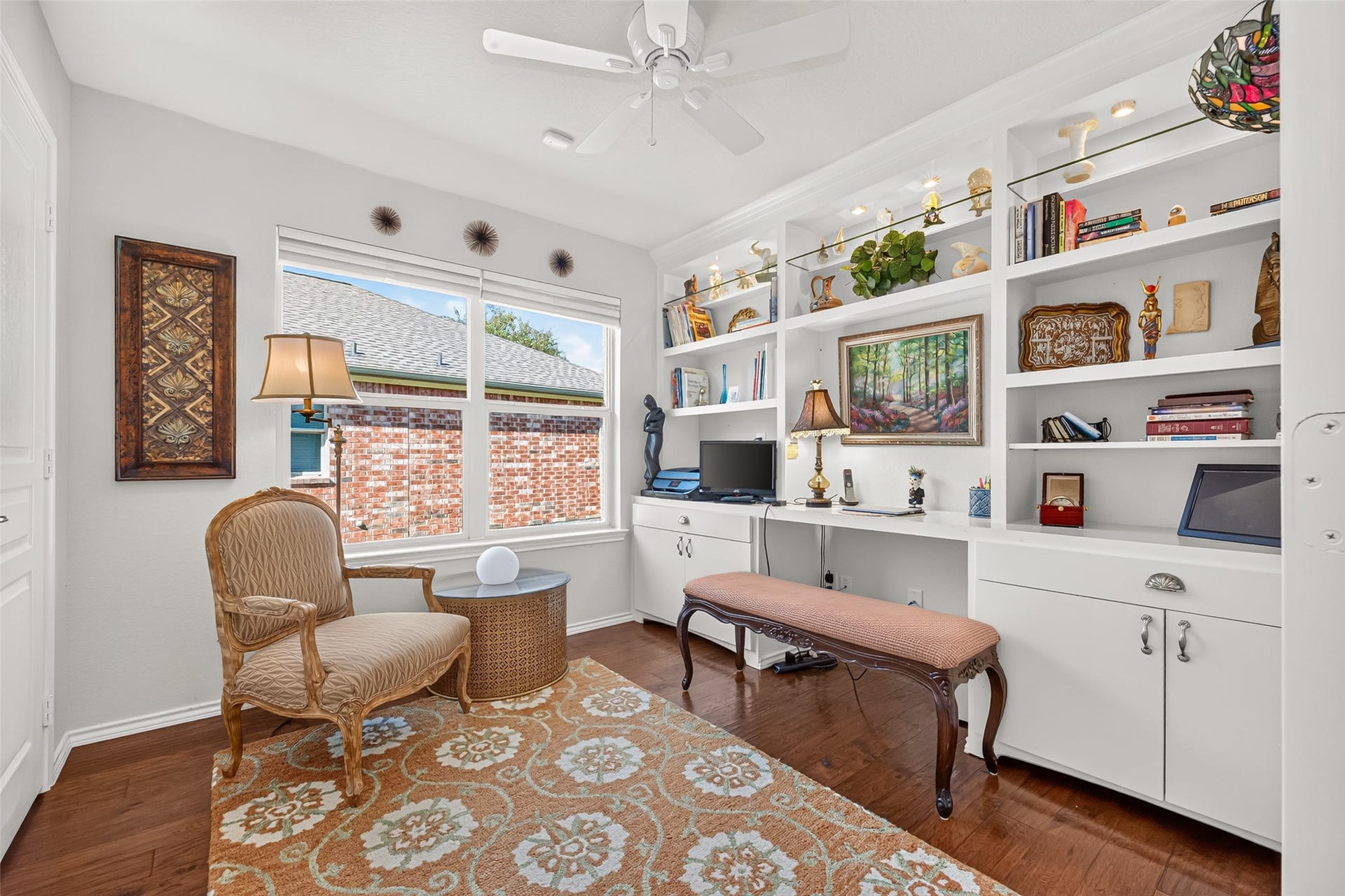 1126 Oleander Way, Richmond, TX 77469 A welcoming home office with a built-in desk and abundant storage.