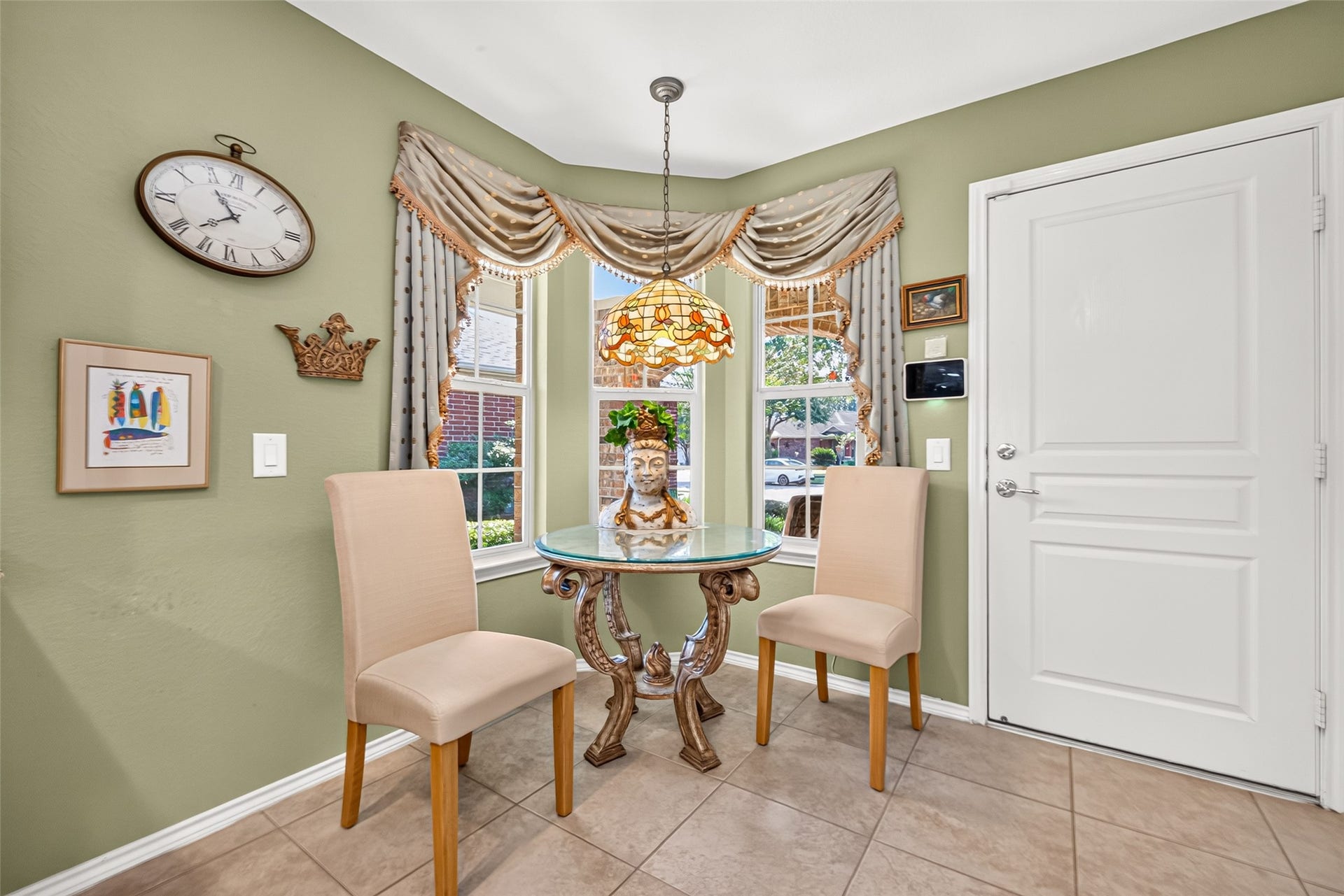 1126 Oleander Way, Richmond, TX 77469 A sunny breakfast nook with beautiful custom stained glass.