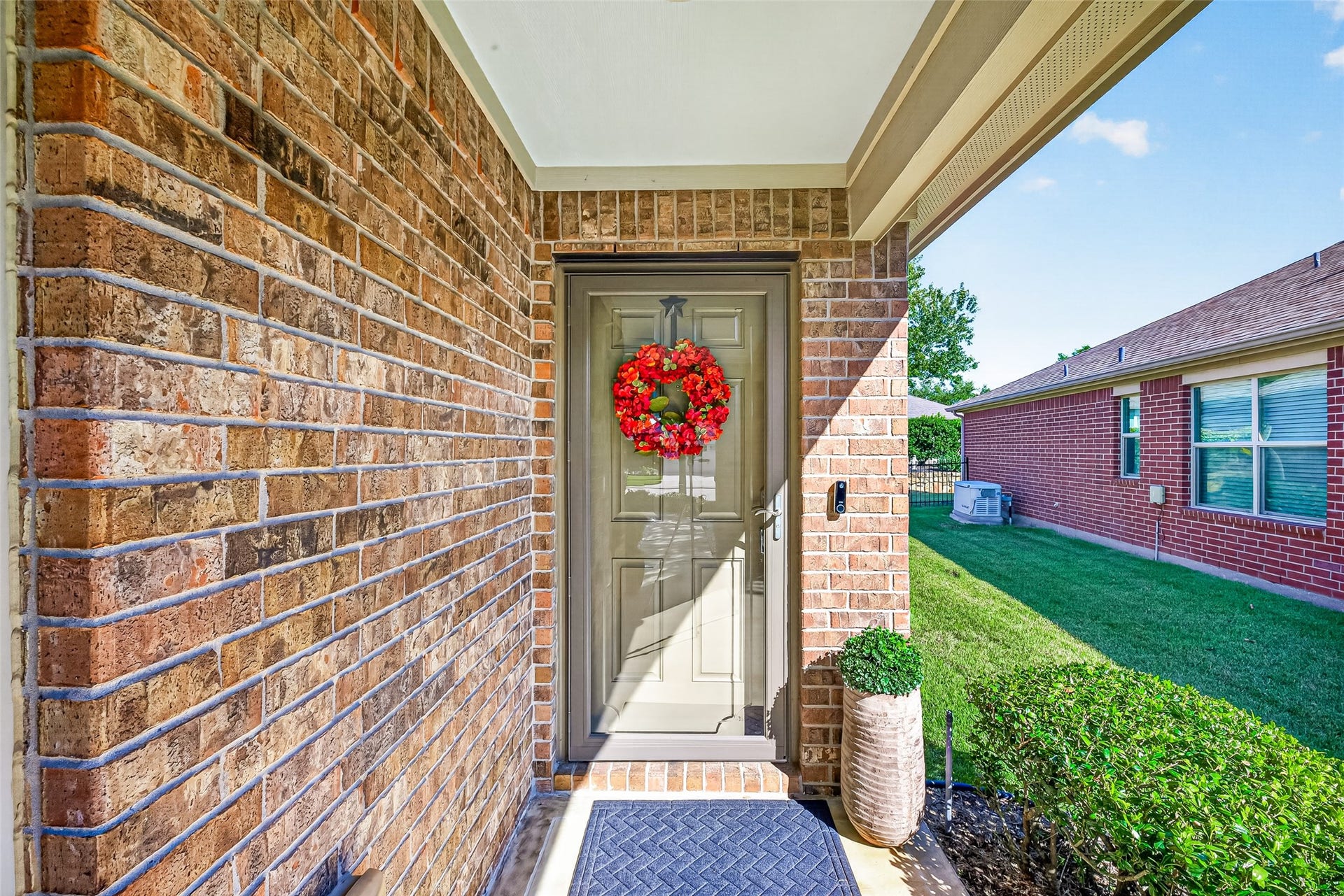 1126 Oleander Way, Richmond, TX 77469 A charming arched entrance makes a warm first impression.