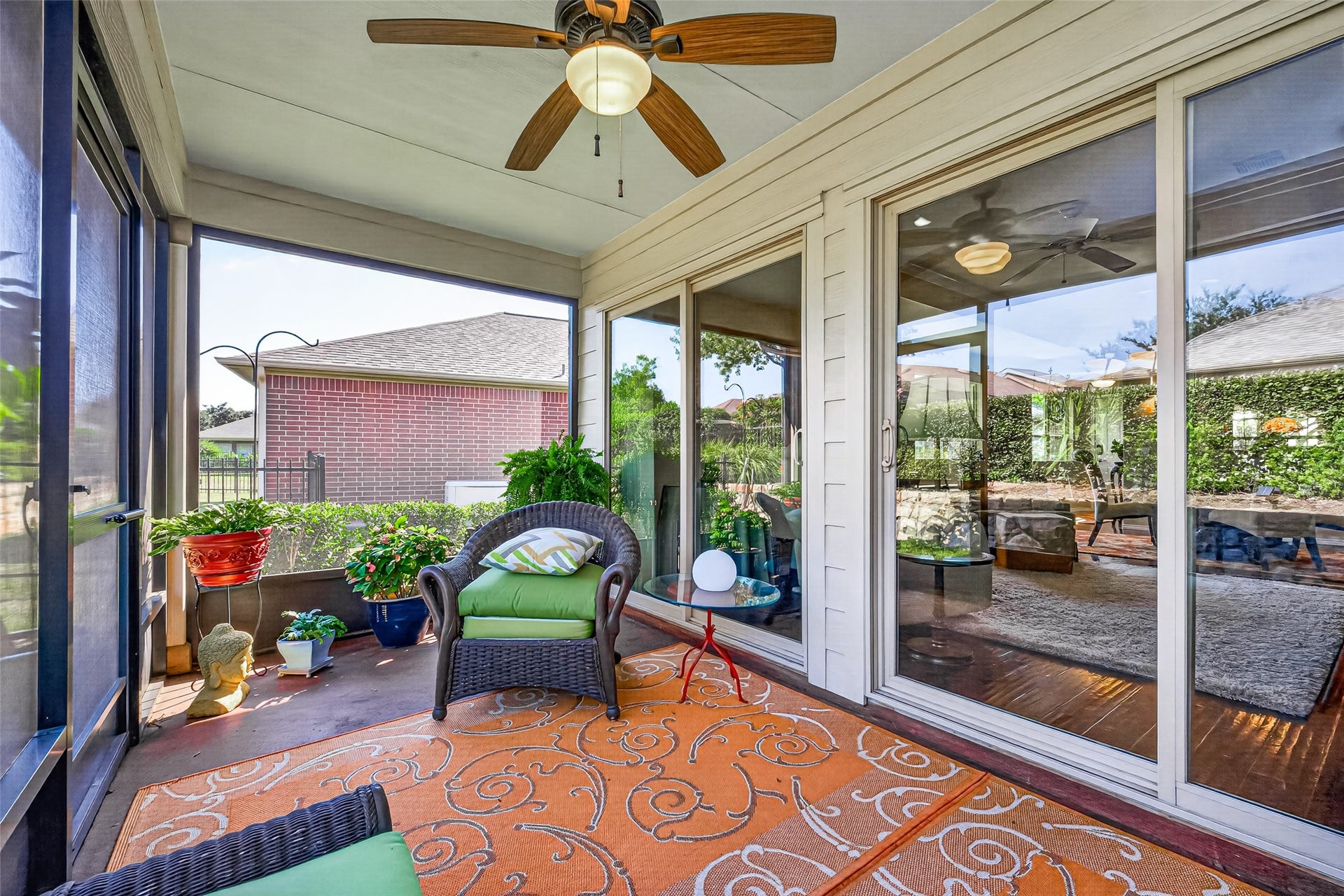 1126 Oleander Way, Richmond, TX 77469 Sliding glass doors connect indoor comfort with porch-side relaxation.