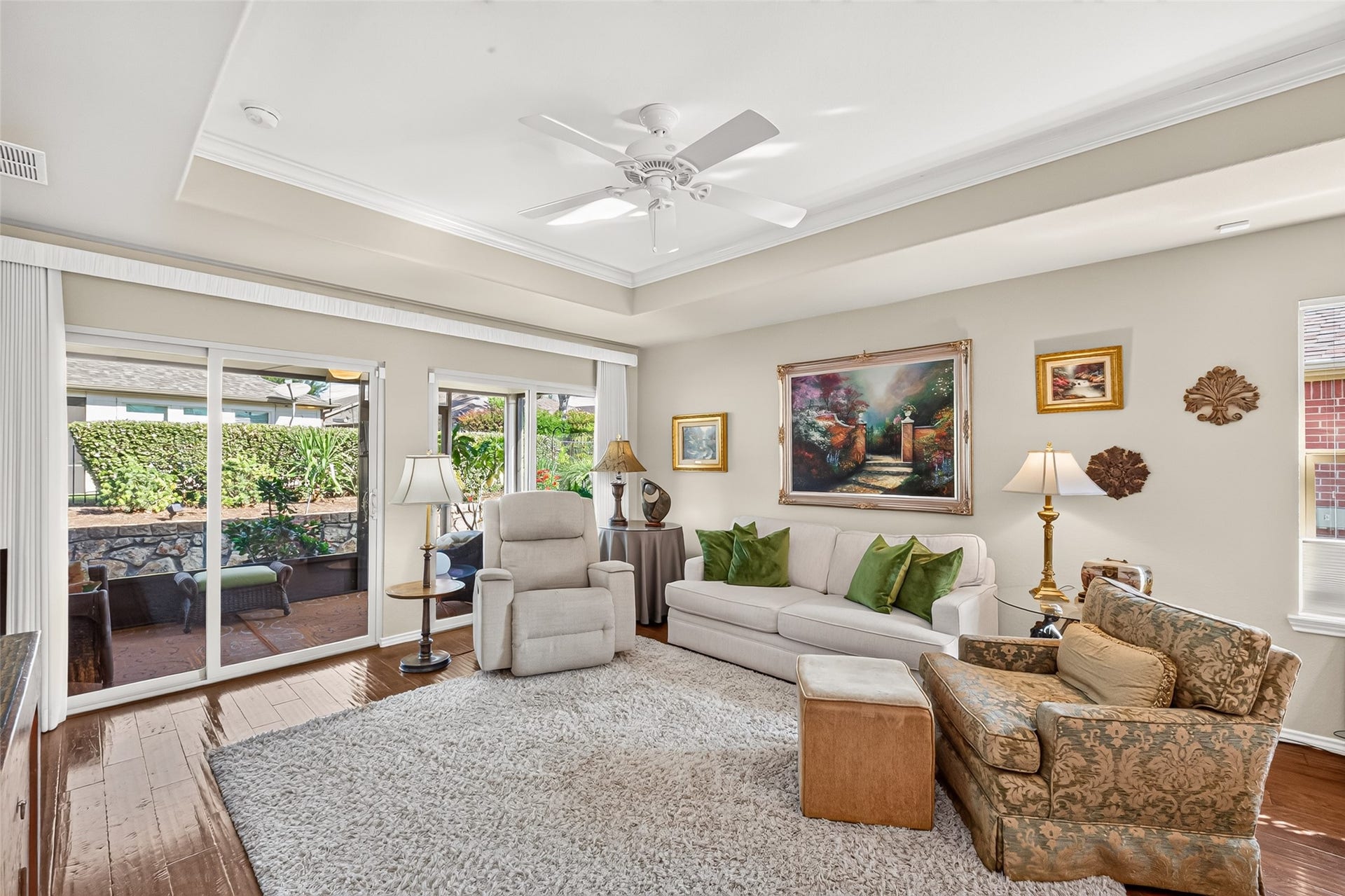 1126 Oleander Way, Richmond, TX 77469 Natural light and patio access brighten this comfortable living area.