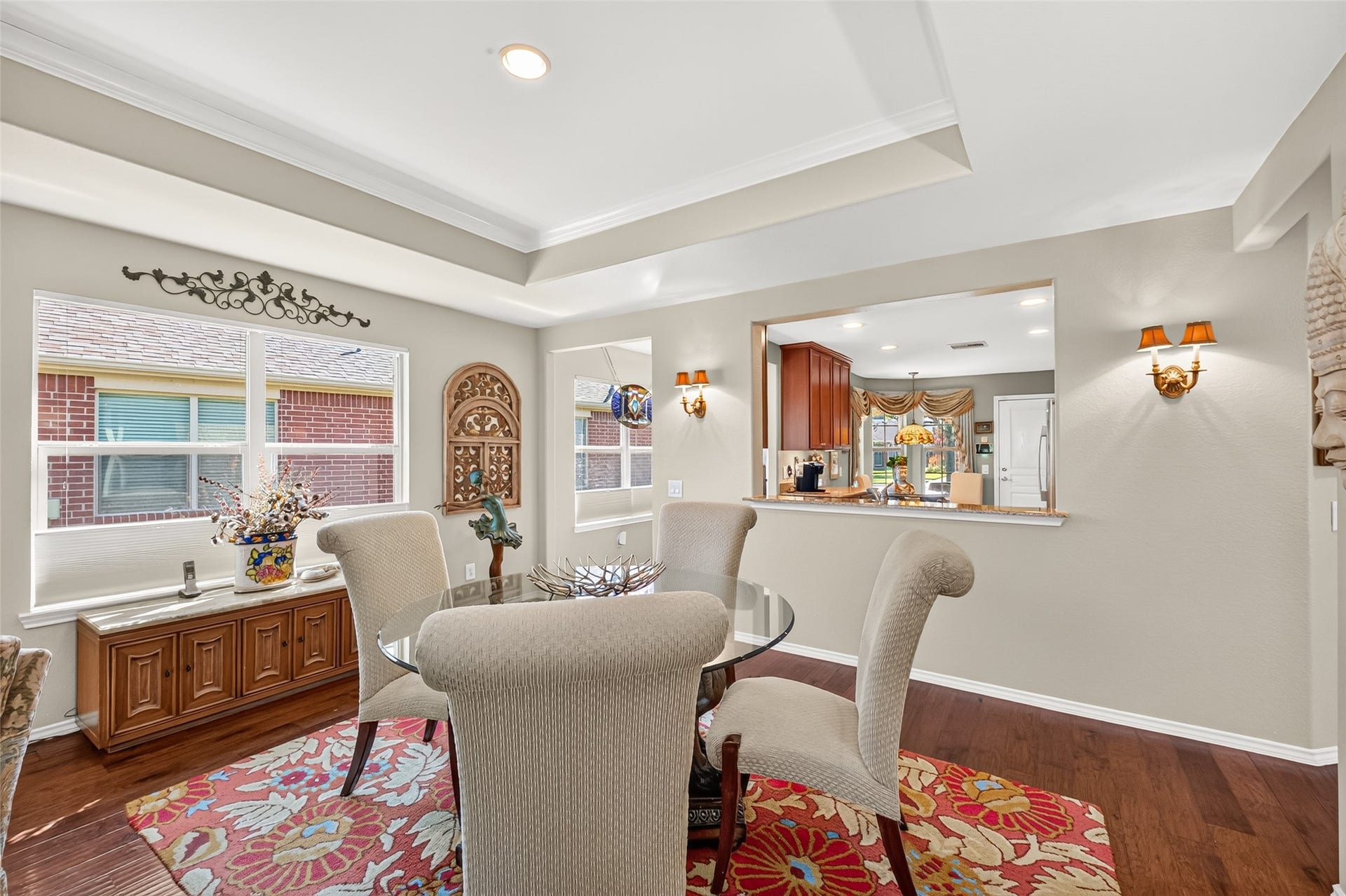 1126 Oleander Way, Richmond, TX 77469 Tray ceilings and hardwood floors add character to the dining space.