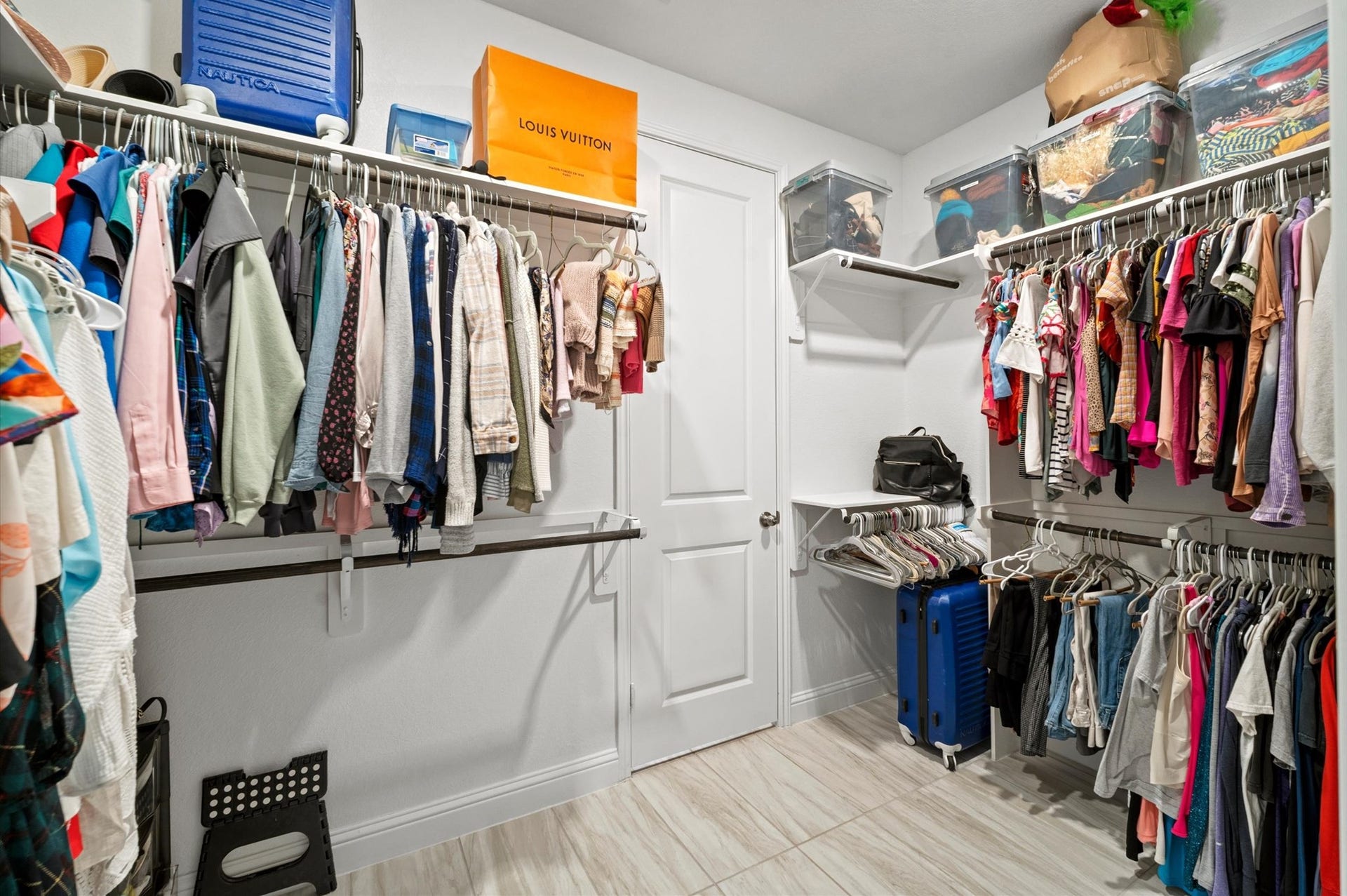 This closet has direct access to the laundry room for added convenience.