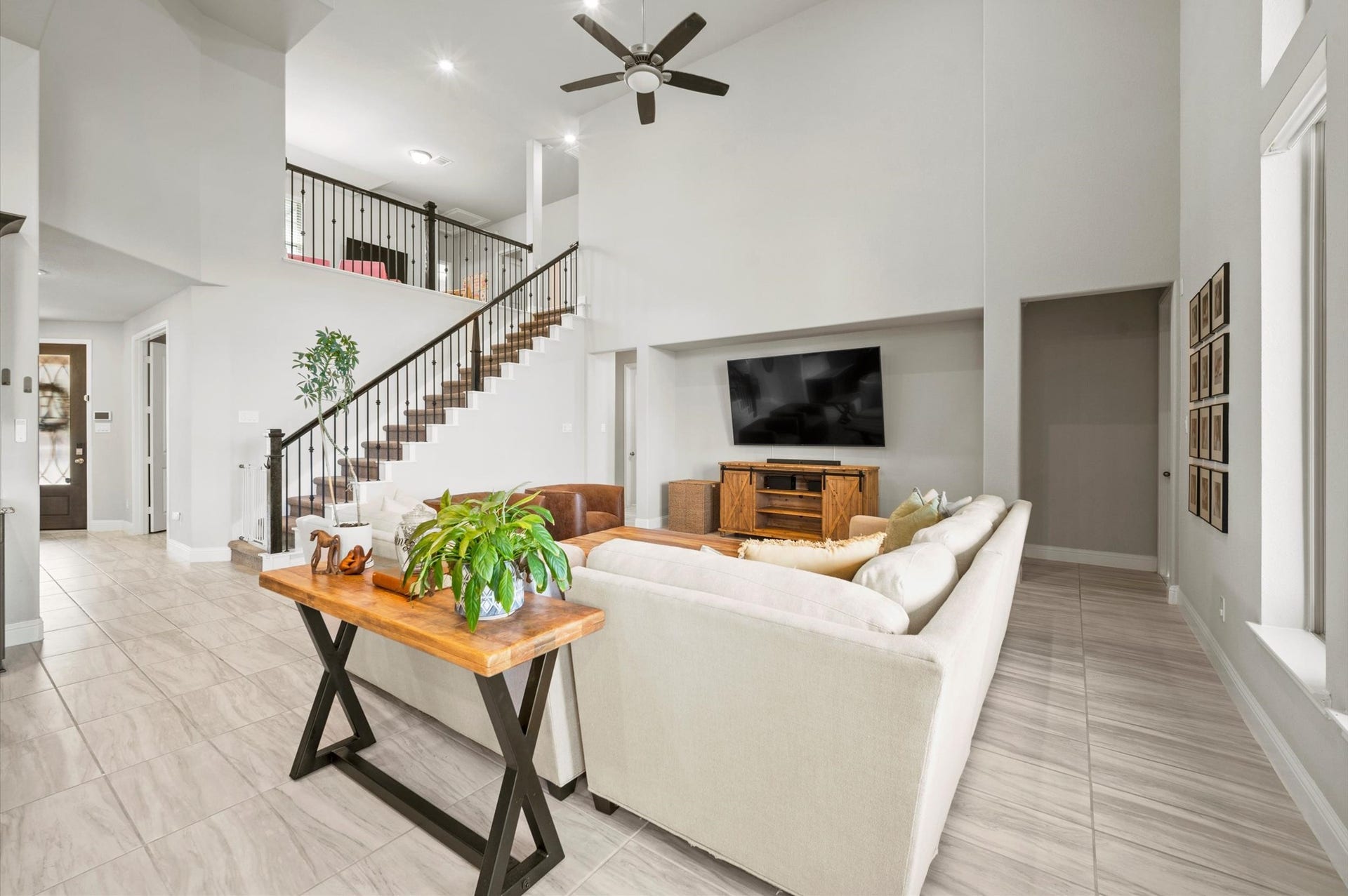 View of the living room, and looking up to the game room.
