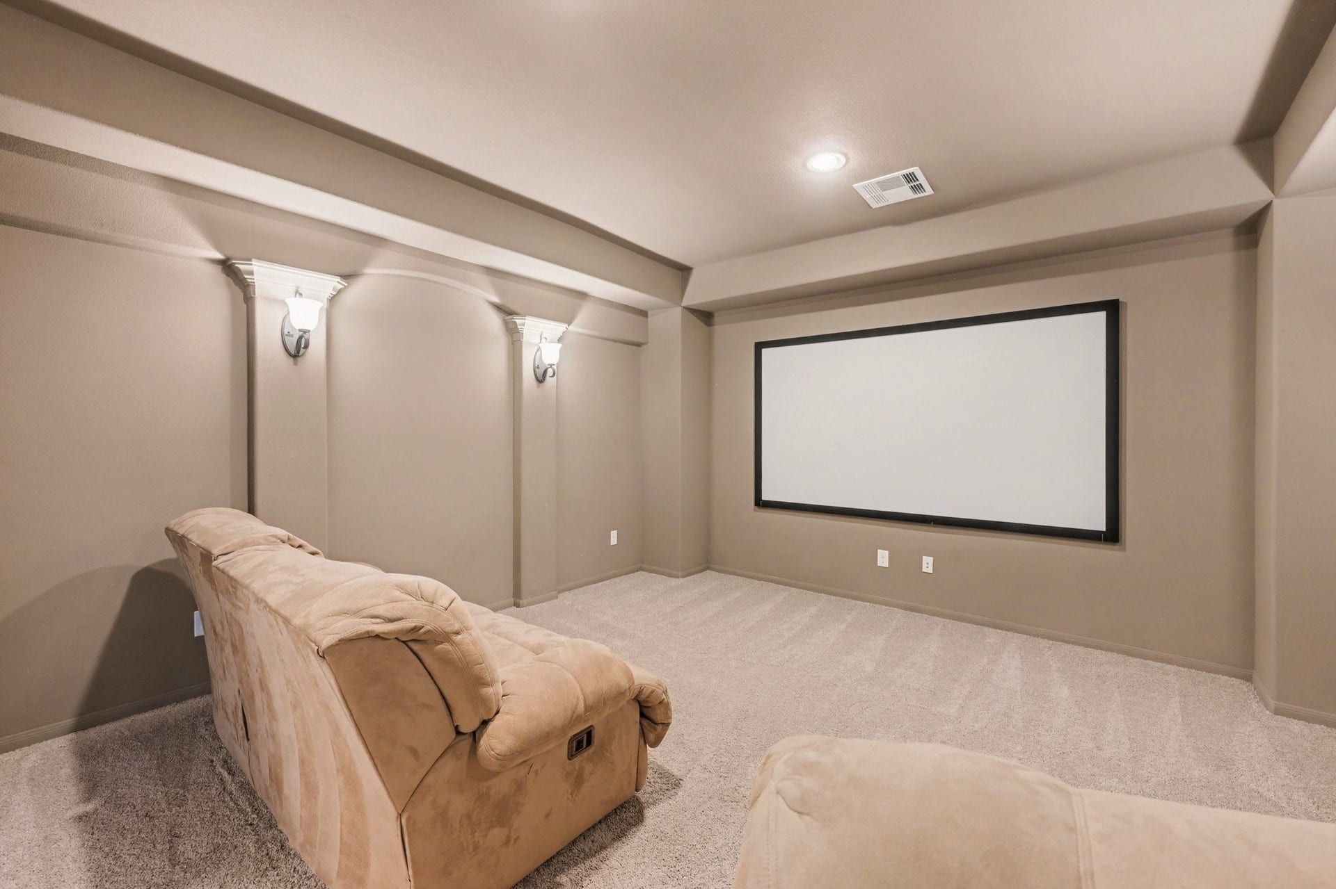 6410 Archer Ranch Lane, Rosenberg, TX 77471 Dedicated upstairs media room with a large projection screen, perfect for movie nights and entertainment.