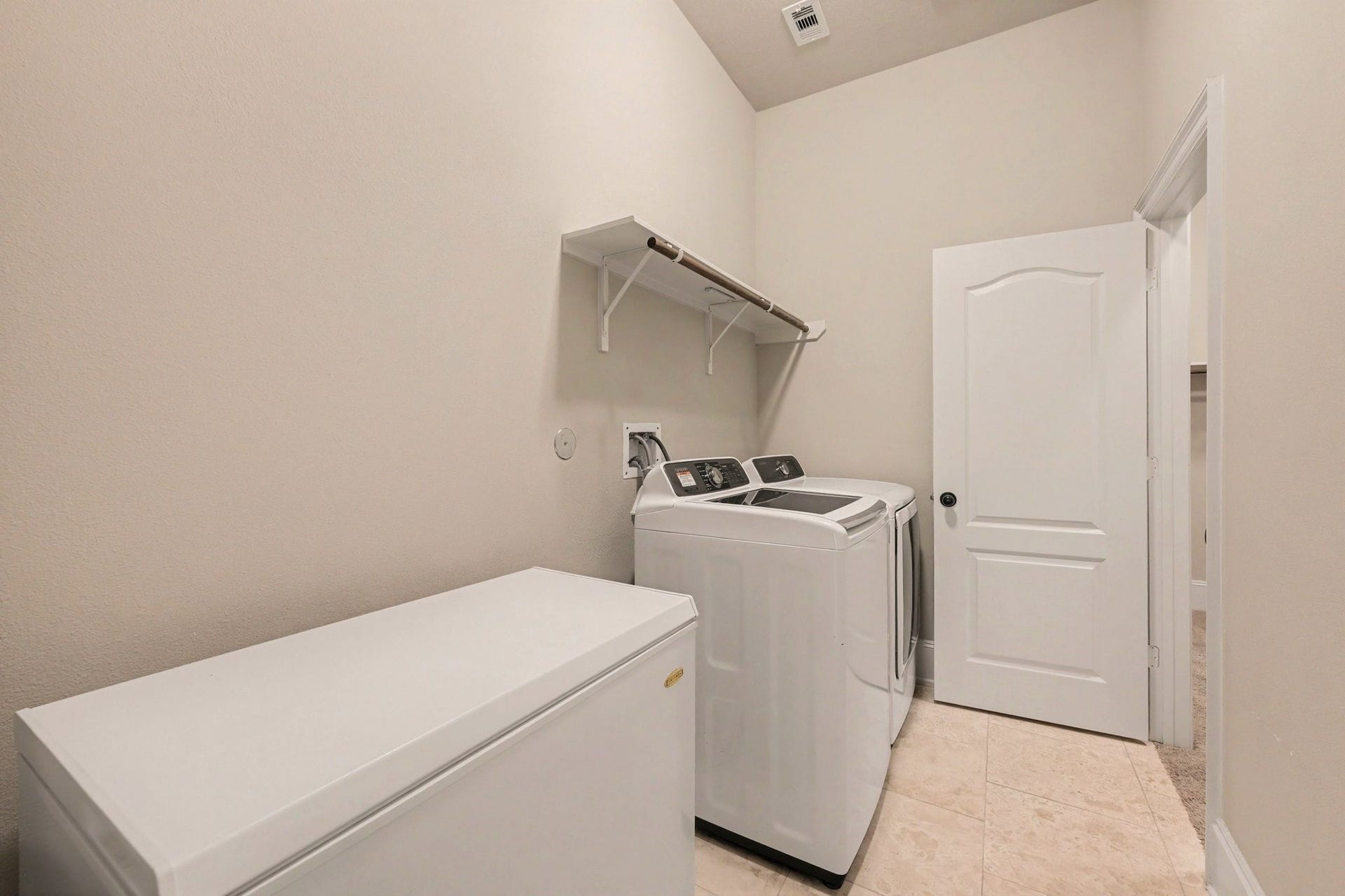6410 Archer Ranch Lane, Rosenberg, TX 77471 The downstairs laundry room has direct access to the enormous primary walk-in closet
