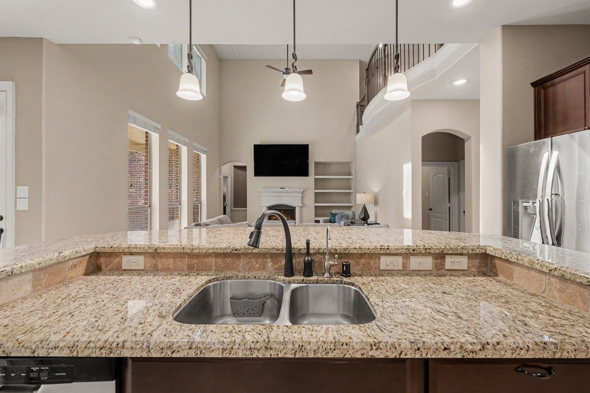 6410 Archer Ranch Lane, Rosenberg, TX 77471 The open kitchen overlooks the two story living room.