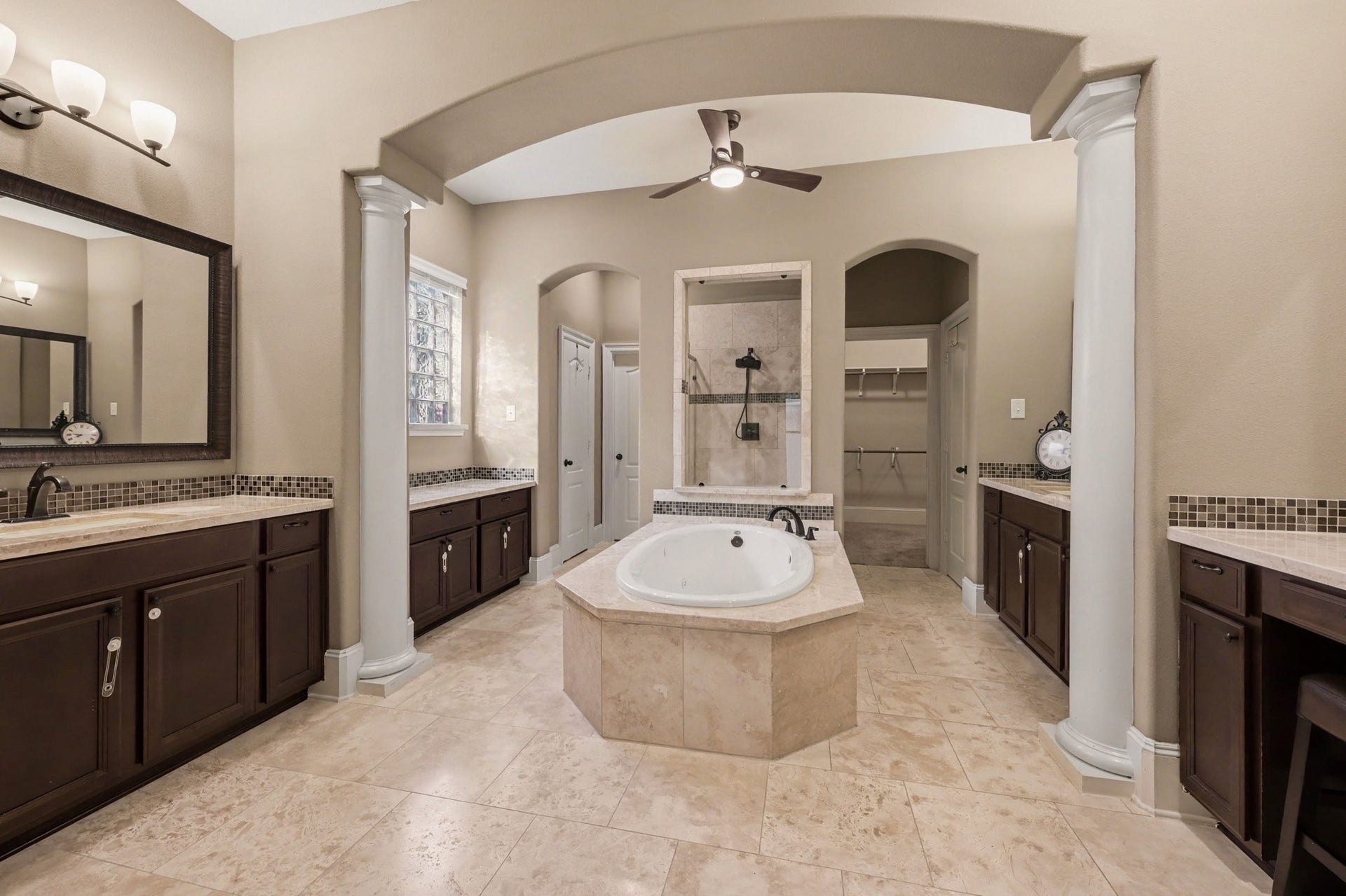 6410 Archer Ranch Lane, Rosenberg, TX 77471 Spacious primary bathroom featuring a jetted soaking tub, separate walk-in shower, dual vanities, and two walk-in closets.