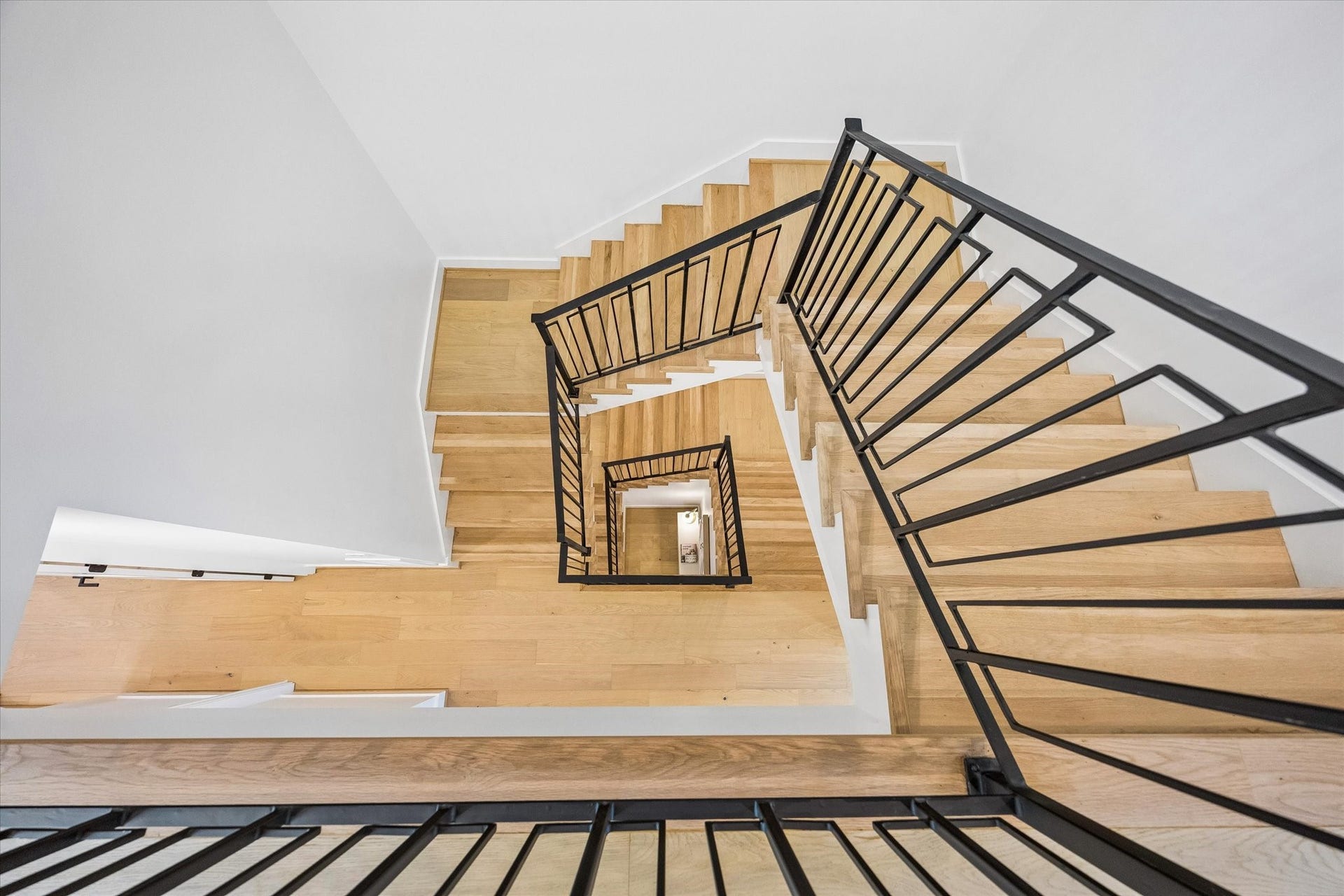 2204 Huldy Street, Houston, TX 77019 View at the top of the staircase on the 3rdfloor looking down. Sleek finishes throughout this stunning new construction!