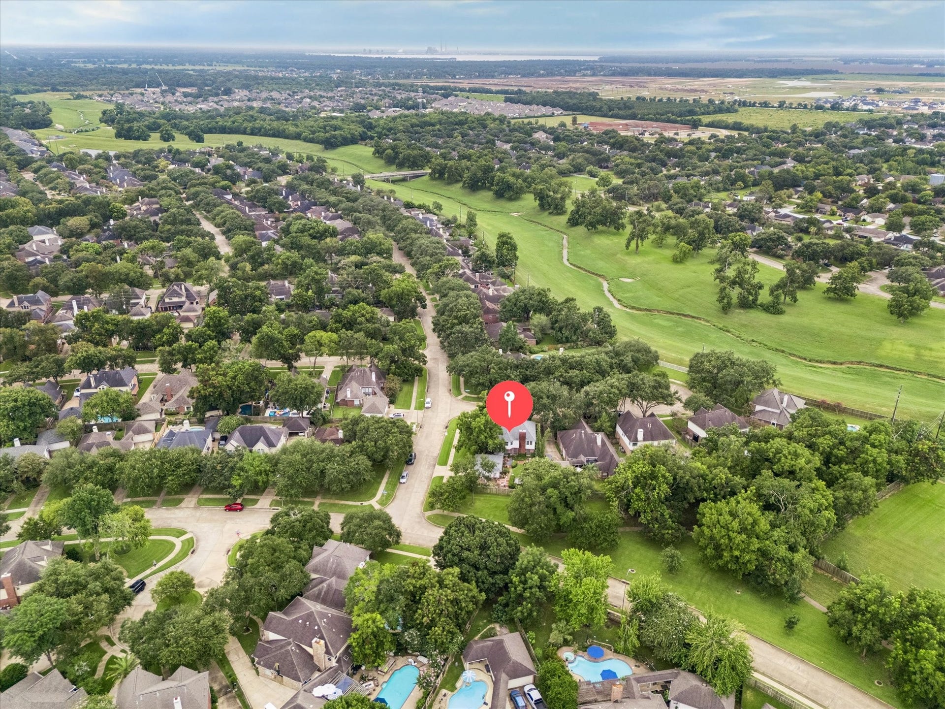 1019 Quiet Glen Court, Sugar Land, TX 77479 Nestled in a lush, tree-lined neighborhood, this home offers serene golf course views and a spacious, inviting community setting.