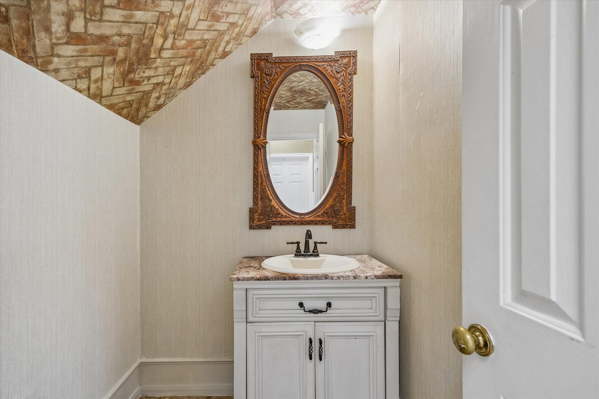 1019 Quiet Glen Court, Sugar Land, TX 77479 Charming powder room featuring a unique brick-patterned wallpaper on the ceiling