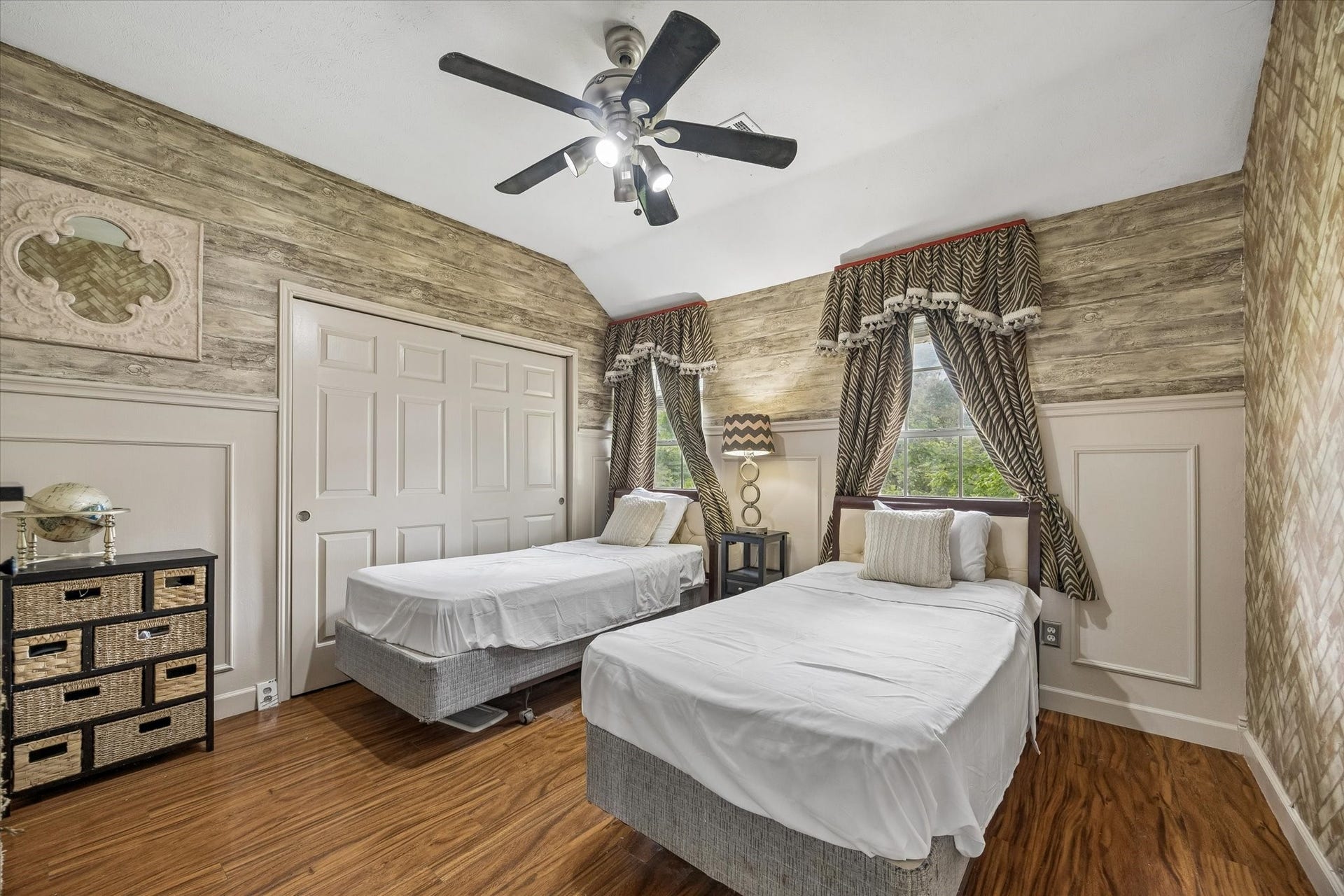 1019 Quiet Glen Court, Sugar Land, TX 77479 Secondary bedroom with sliding closet doors,
wood looking wallpaper, great for single beds, or a larger bed in between the 2 windows.