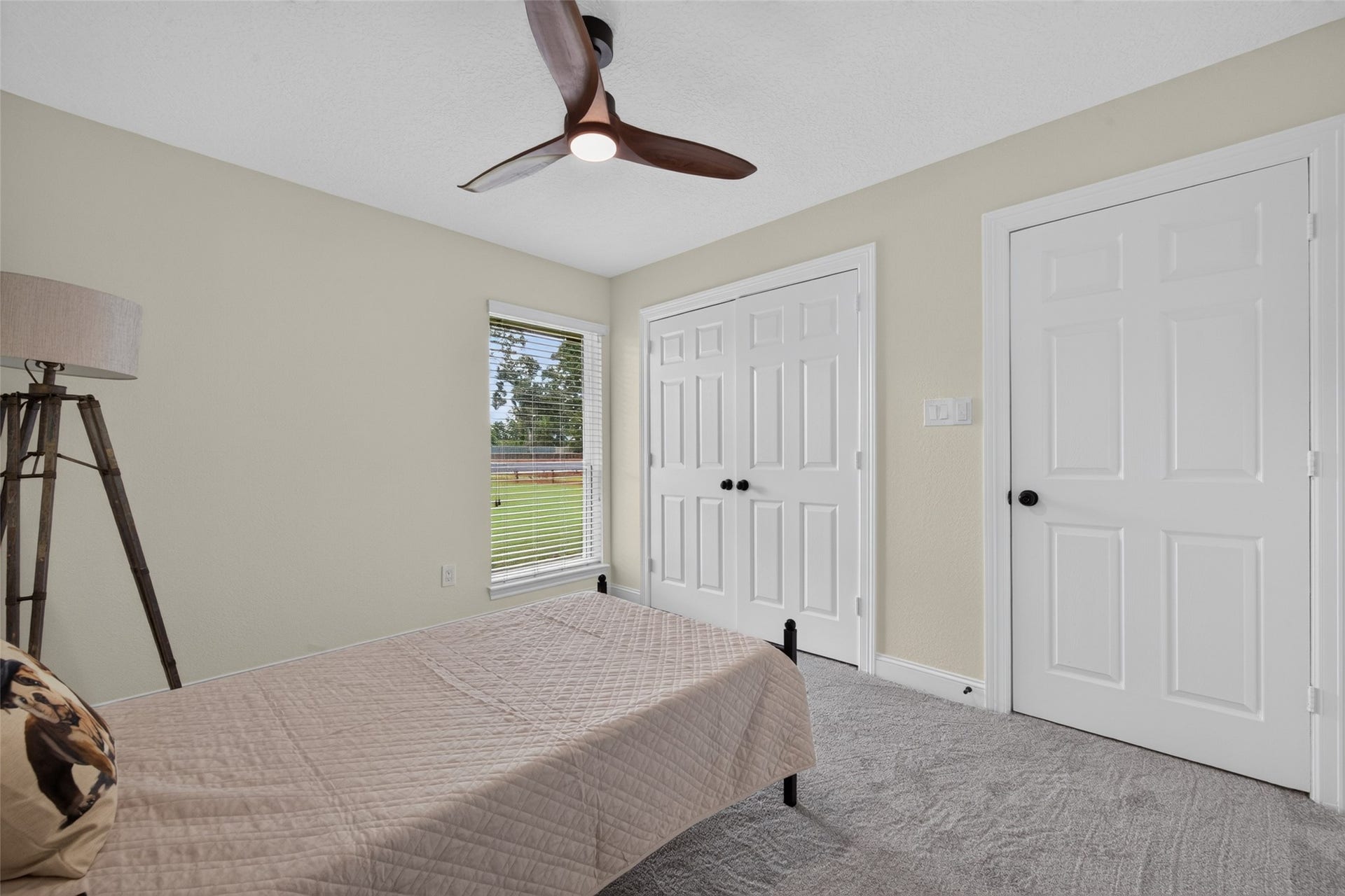 8906 Seber Drive, Tomball, TX 77375 A second view highlights the bedrooms closet space and bright window overlooking the property.