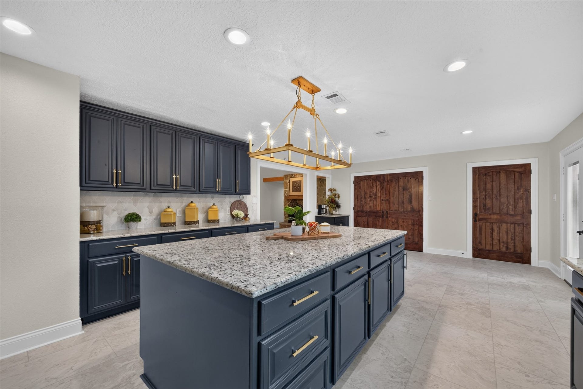8906 Seber Drive, Tomball, TX 77375 Oversized island provides an abundance of prep space, storage and casual seating.