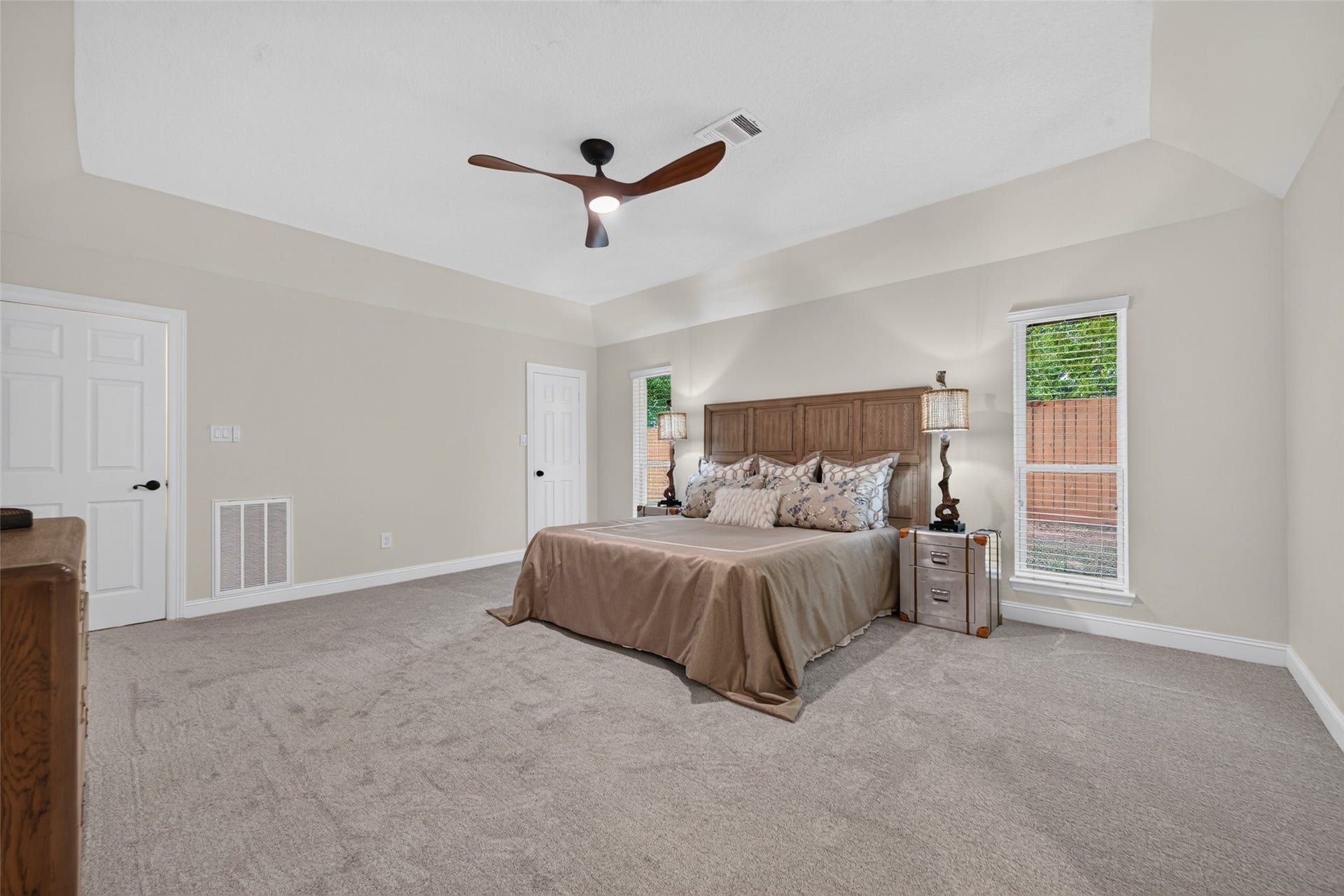8906 Seber Drive, Tomball, TX 77375 Primary suite offers a comfortable retreat with neutral finishes, soft carpeting and natural light.