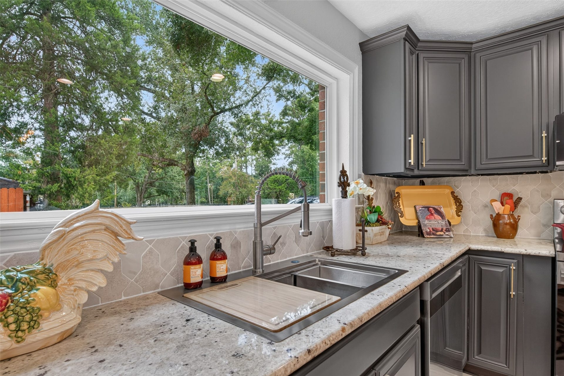8906 Seber Drive, Tomball, TX 77375 Enjoy outdoor views from the kitchen sink through the expansive picture window.