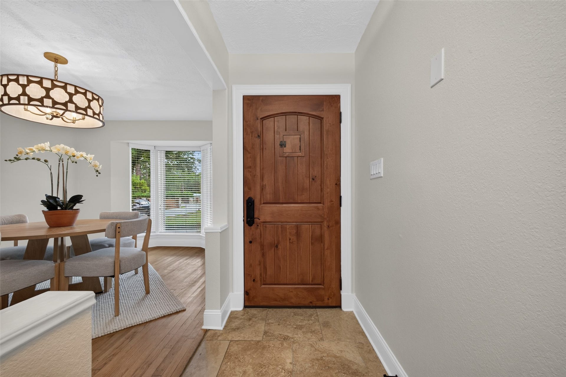 8906 Seber Drive, Tomball, TX 77375 Beautiful wood front door adds warmth and character from the moment you enter.