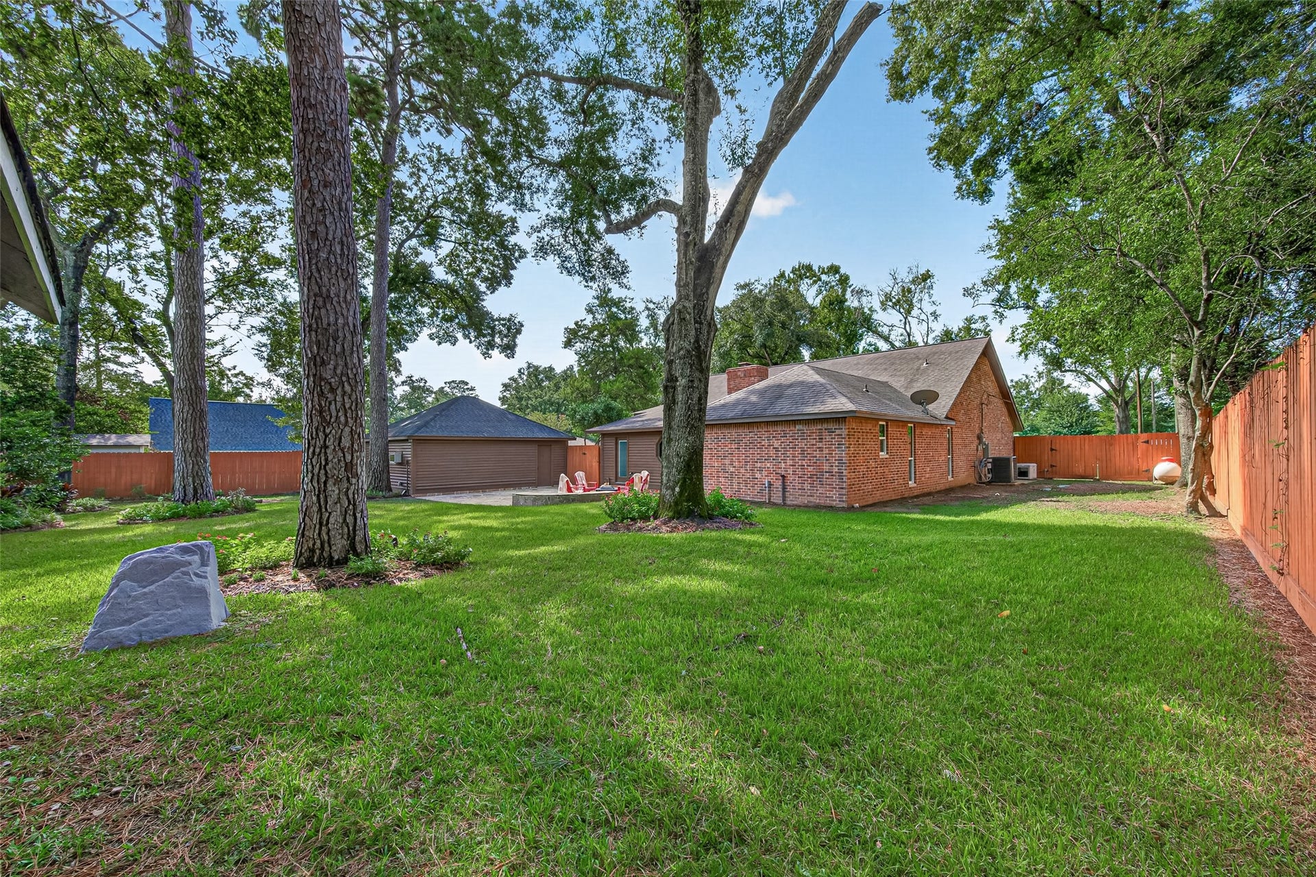 8906 Seber Drive, Tomball, TX 77375 This expansive backyard allows you to create your own peaceful and inviting space for all of your gatherings.