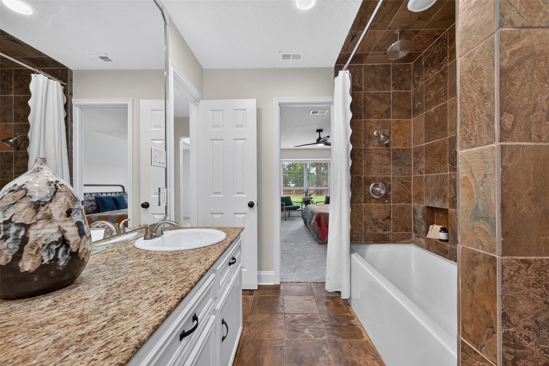 8906 Seber Drive, Tomball, TX 77375 Another view of the secondary bath highlights the tile-surround tub/shower and convenient layout.
