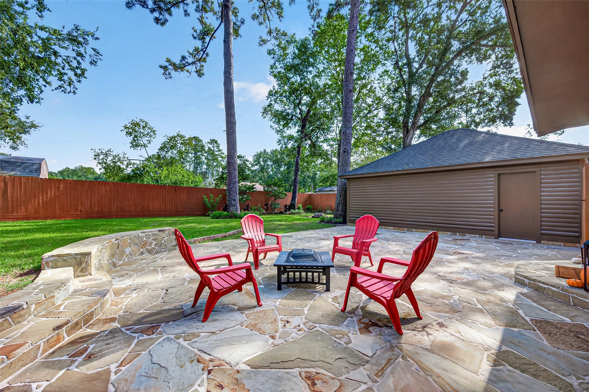 8906 Seber Drive, Tomball, TX 77375 Beyond the patio, the backyard opens to an impressive amount of green space with towering mature trees and plenty of room to enjoy the outdoors.