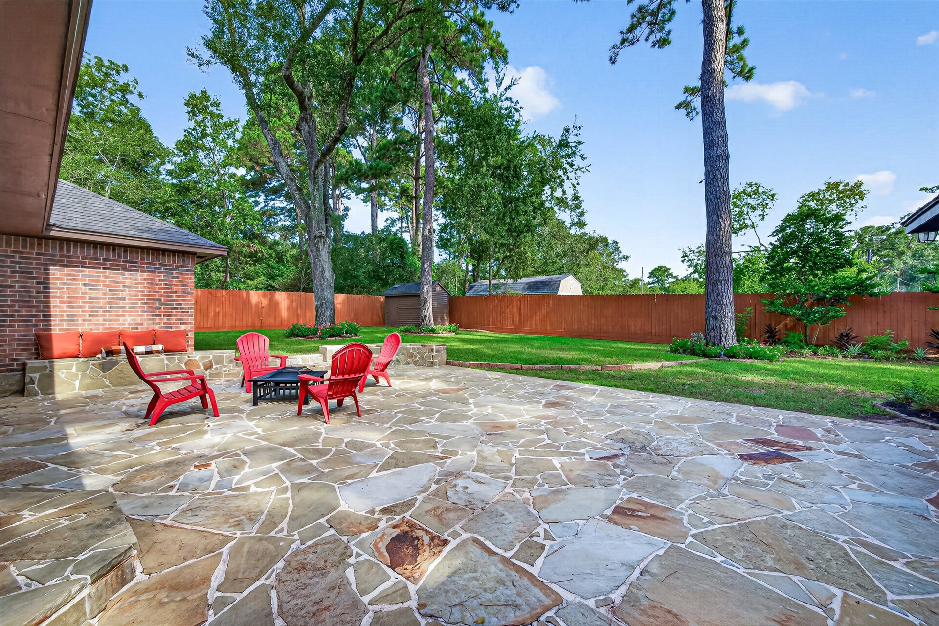 8906 Seber Drive, Tomball, TX 77375 Step around back and discover this spacious stone patioa wonderful spot to gather around a fire pit or patio furnishings of your own choosing, entertain friends or simply unwind beneath the shade of the mature trees.