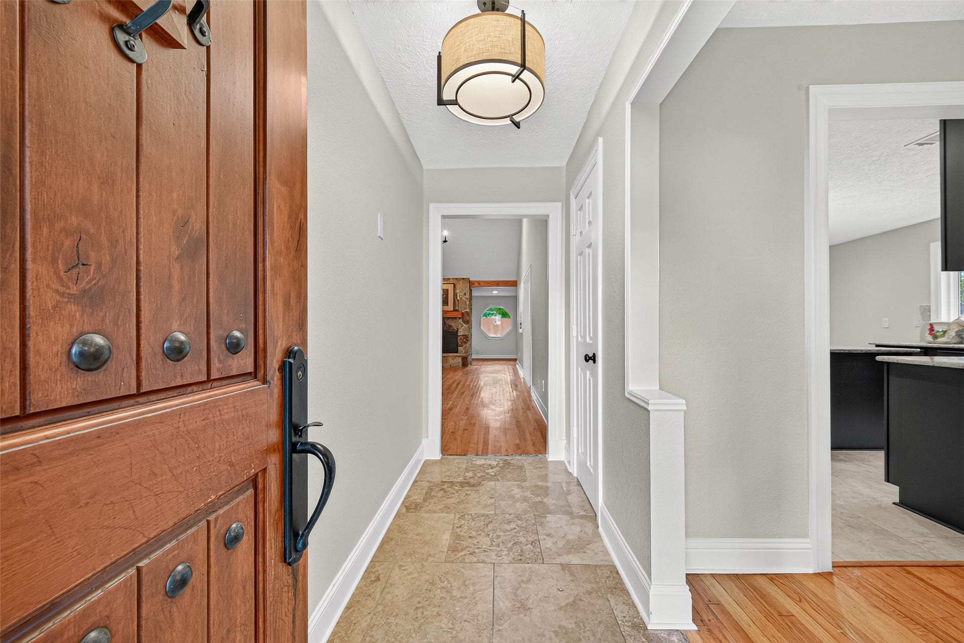 8906 Seber Drive, Tomball, TX 77375 Step inside to a welcoming entry with warm wood details and neutral finishes.