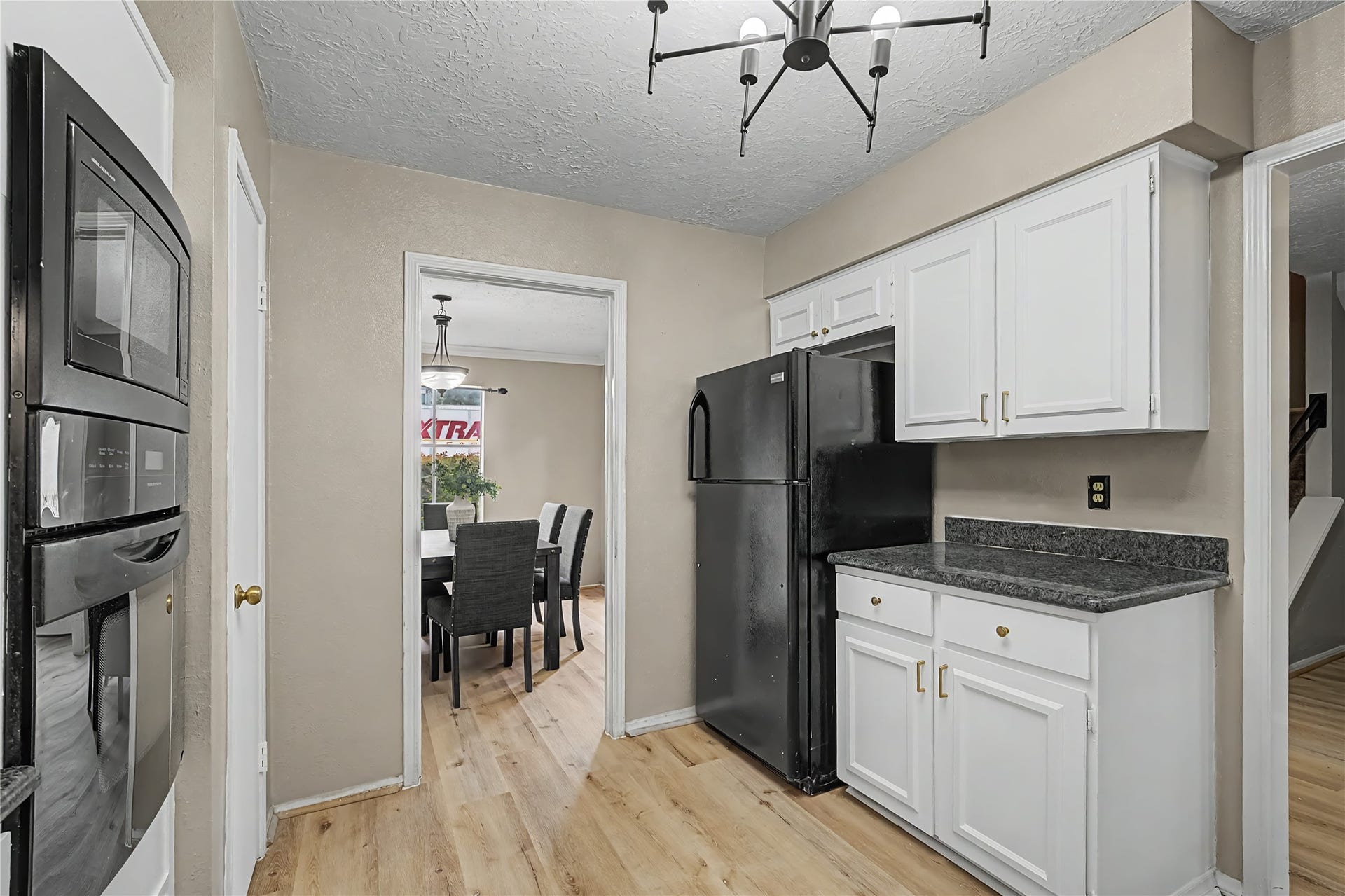 Another angle of the kitchen leading into the dining room.