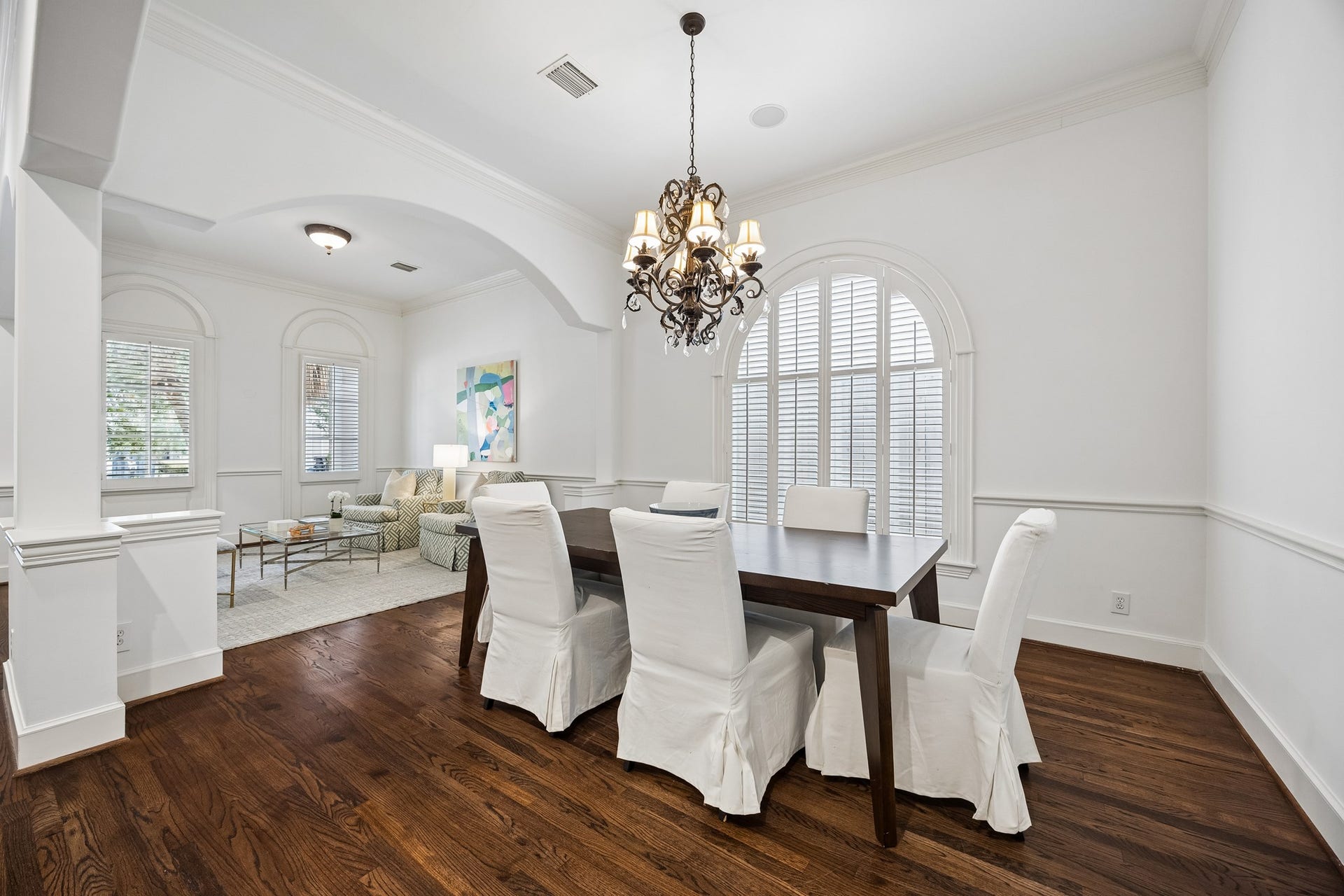 2214 Driscoll Street, Houston, TX 77019 Formal dining spaces boasts a beautiful arched window and open seamlessly to the sitting area and steps from the kitchen