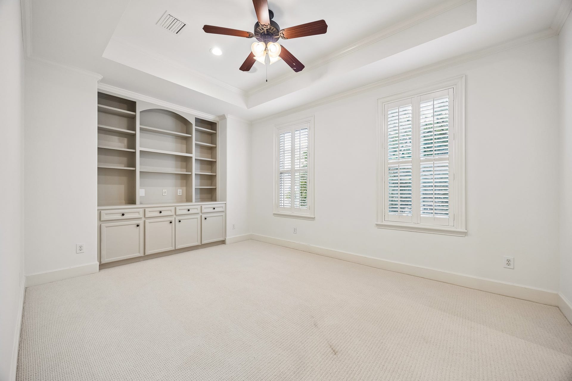 2214 Driscoll Street, Houston, TX 77019 Additional sitting area off of the primary suite, offers built-ins and two window that overlook the backyard space
