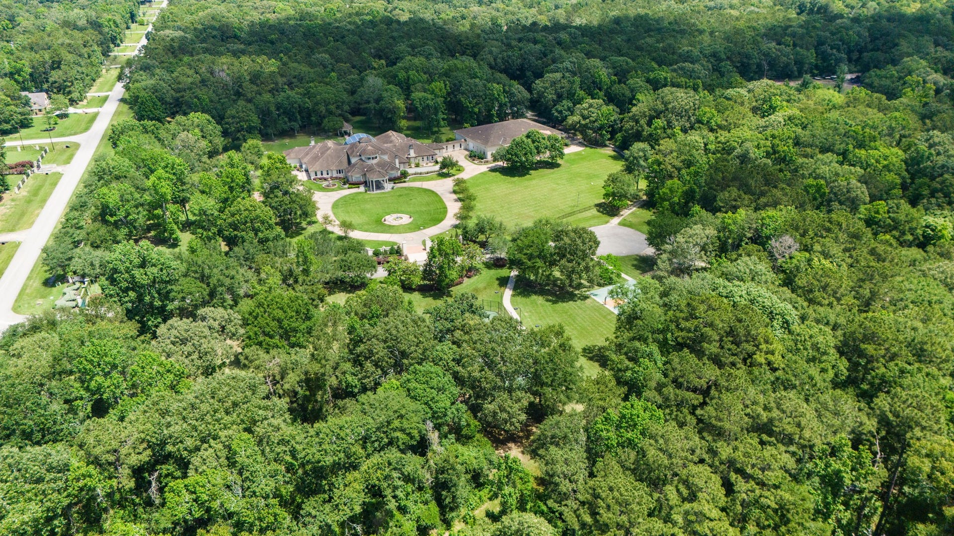 29310 Martelly Way, Huffman, TX 77336 A rare private estate unfolds across sprawling, tree-lined grounds, offering an extraordinary blend of seclusion, grandeur, and resort-inspired living.