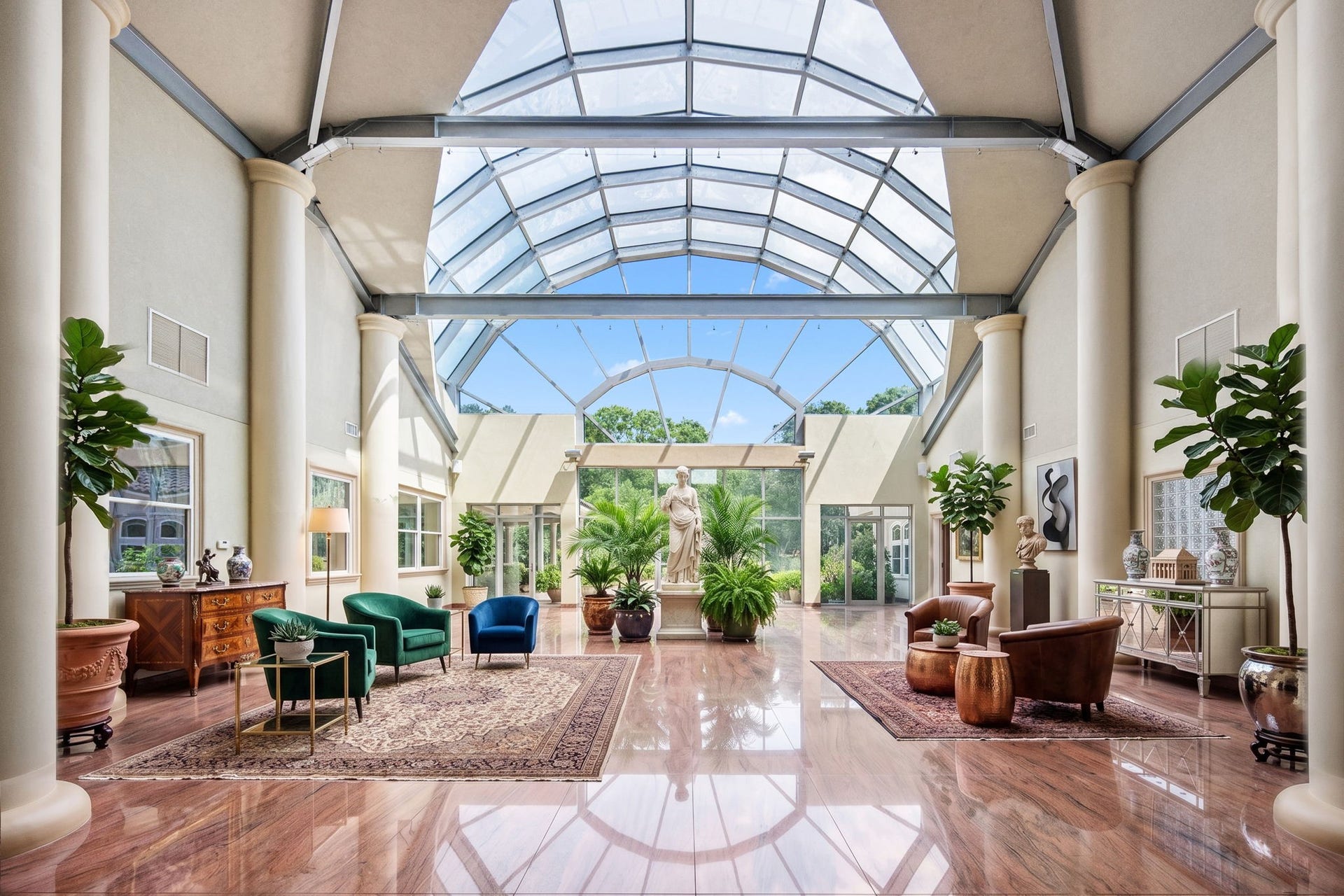 29310 Martelly Way, Huffman, TX 77336 An abundance of natural light beneath a dramatic glass-vaulted ceiling, the family room has steel infrastructure and creates a seamless connection between the home's interior and surrounding grounds, offering an extraordinary space for entertaining or quiet reflection.