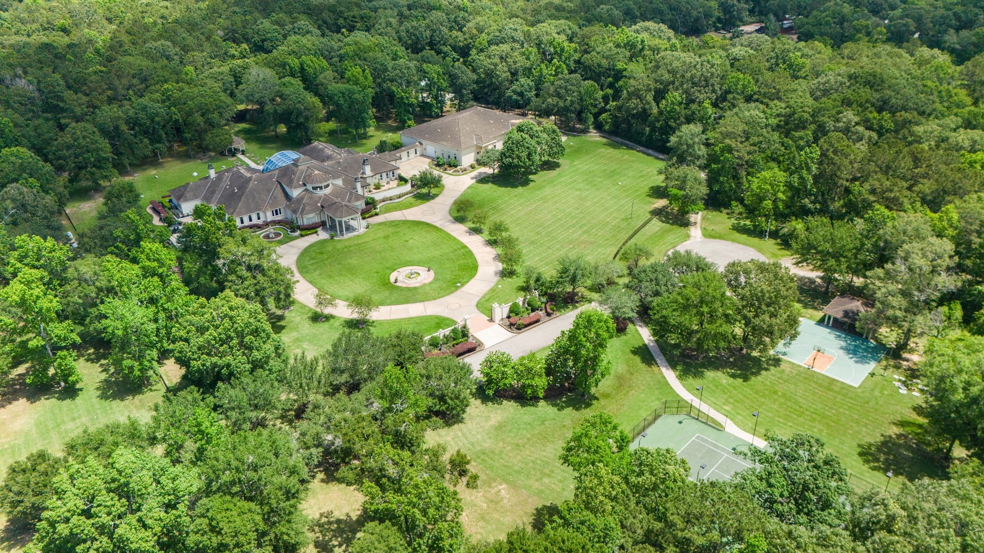29310 Martelly Way, Huffman, TX 77336 Expansive manicured lawns, mature hardwoods, and winding drives create a setting of remarkable beauty and privacy rarely found on this scale.
