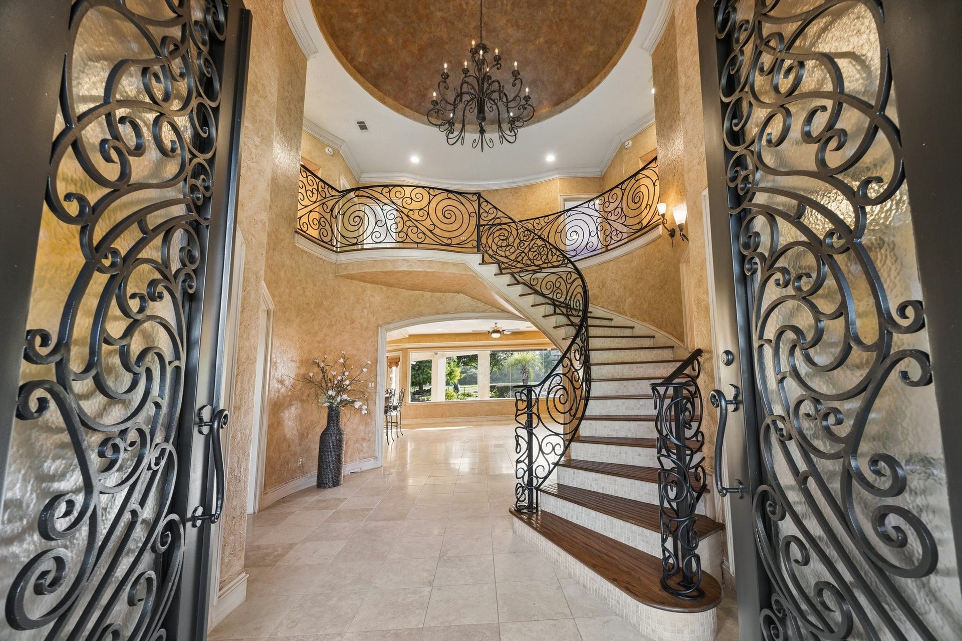 2811 Hinkles Ferry, Richmond, TX 77406 Immediately you're greeted with the view of the back yard oasis, grand staircase and dome ceiling