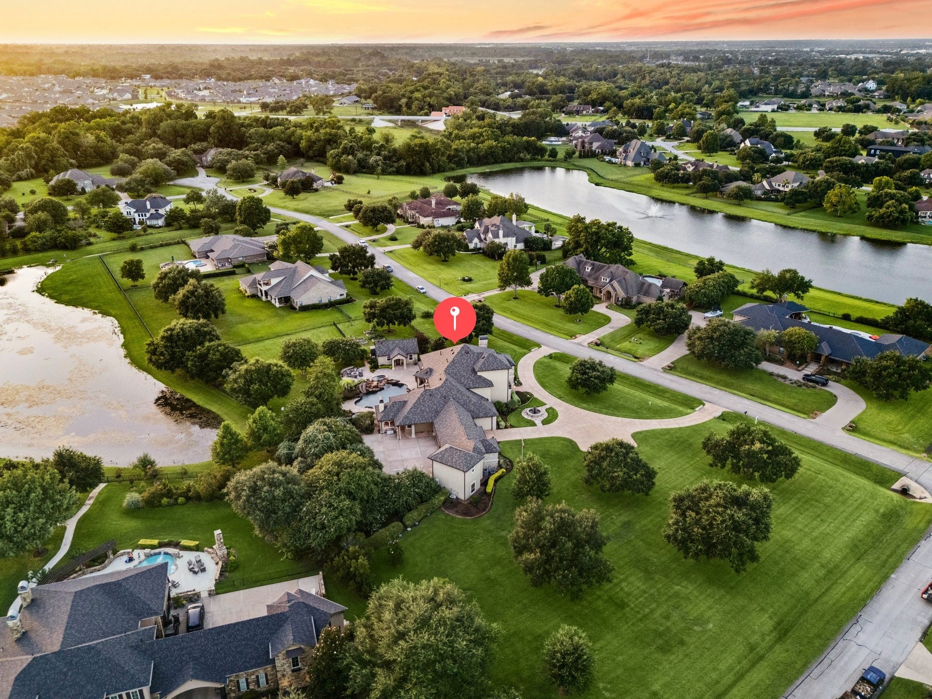 2811 Hinkles Ferry, Richmond, TX 77406 Multigenerational living where the whole family can relax - fishing, koi pond, and balcony views all around.