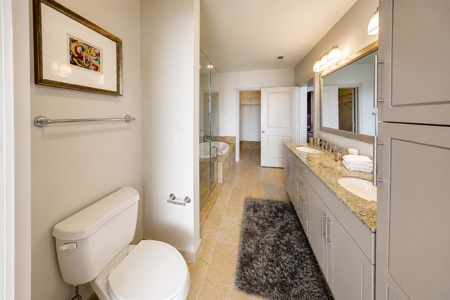 1400 McKinney Street, #2401, Houston, TX 77010 Well-appointed primary bath offers an expansive dual-sink vanity, lots of drawers, linen closets, generous storage, granite countertops and direct access to the spacious walk-in closet.