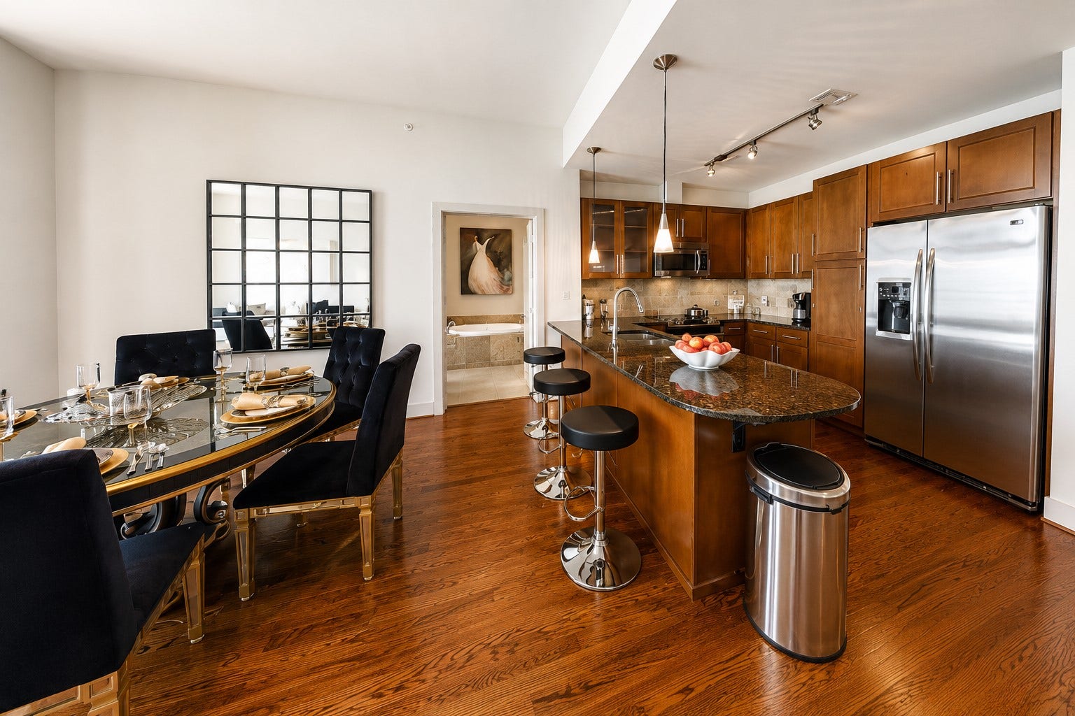 1400 McKinney Street, #2401, Houston, TX 77010 Gourmet kitchen offers a dining island, granite countertops, stainless steel appliances, abundant cabinetry and generous counter space, opening effortlessly to the dining and living areas.