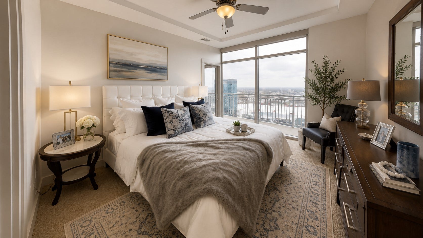 1400 McKinney Street, #2401, Houston, TX 77010 Serene primary bedroom features floor-to-ceiling windows, balcony access and sweeping views from this exceptional high-rise setting.