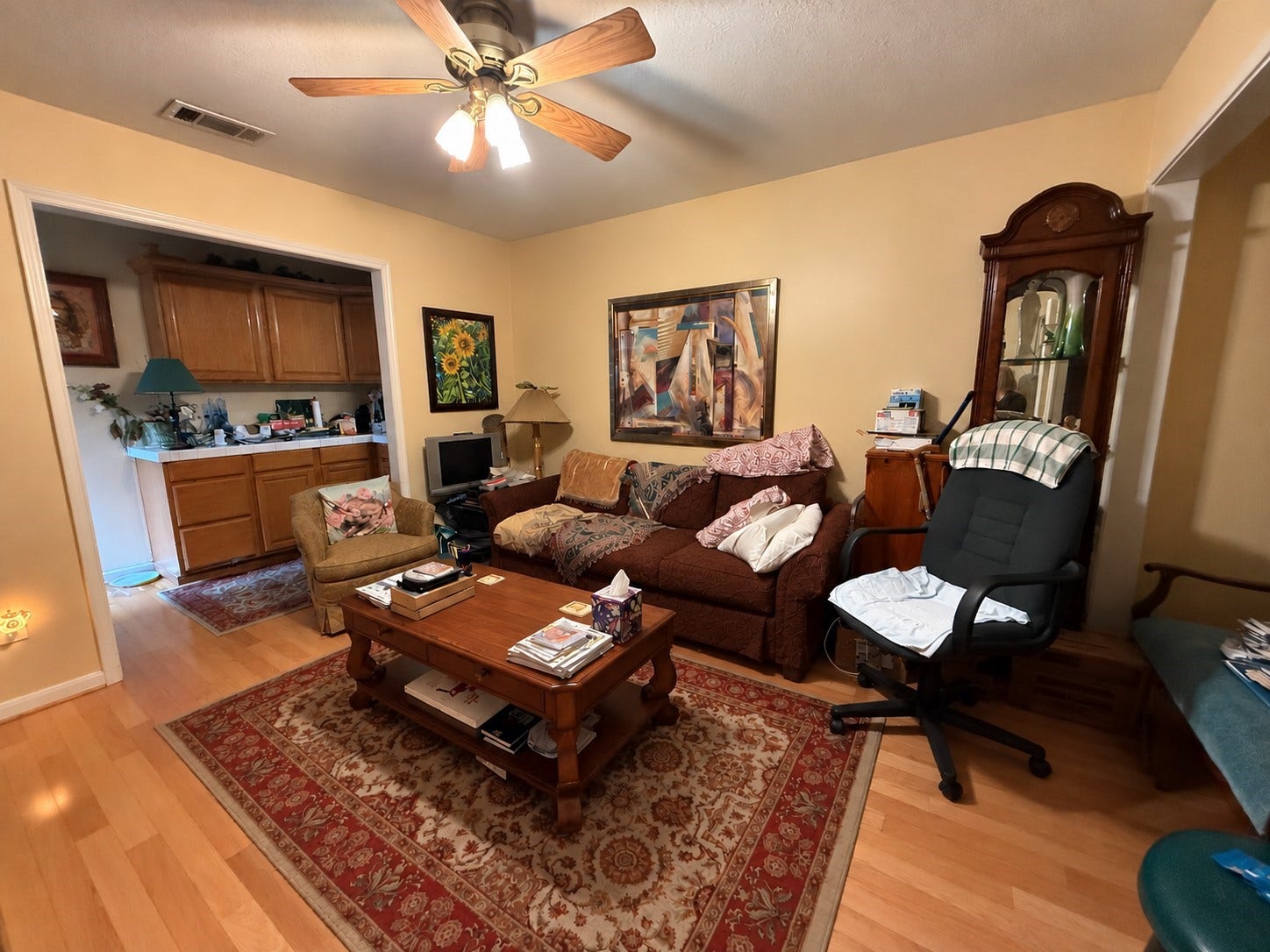 1600 Carriage Run W, Conroe, TX 77384 A Versatile Sitting Room with Endless Possibilities! This generously sized sitting area adjoining Bedroom 2 offers wonderful flexibility, whether used as a private lounge, cozy media room, or additional living space for extended-stay guests. Beautiful wood flooring adds warmth, while a lighted ceiling fan provides year-round comfort. With convenient access directly from the hallway, this spacious room can also function independently, making it a fantastic bonus space to suit your lifestyle!