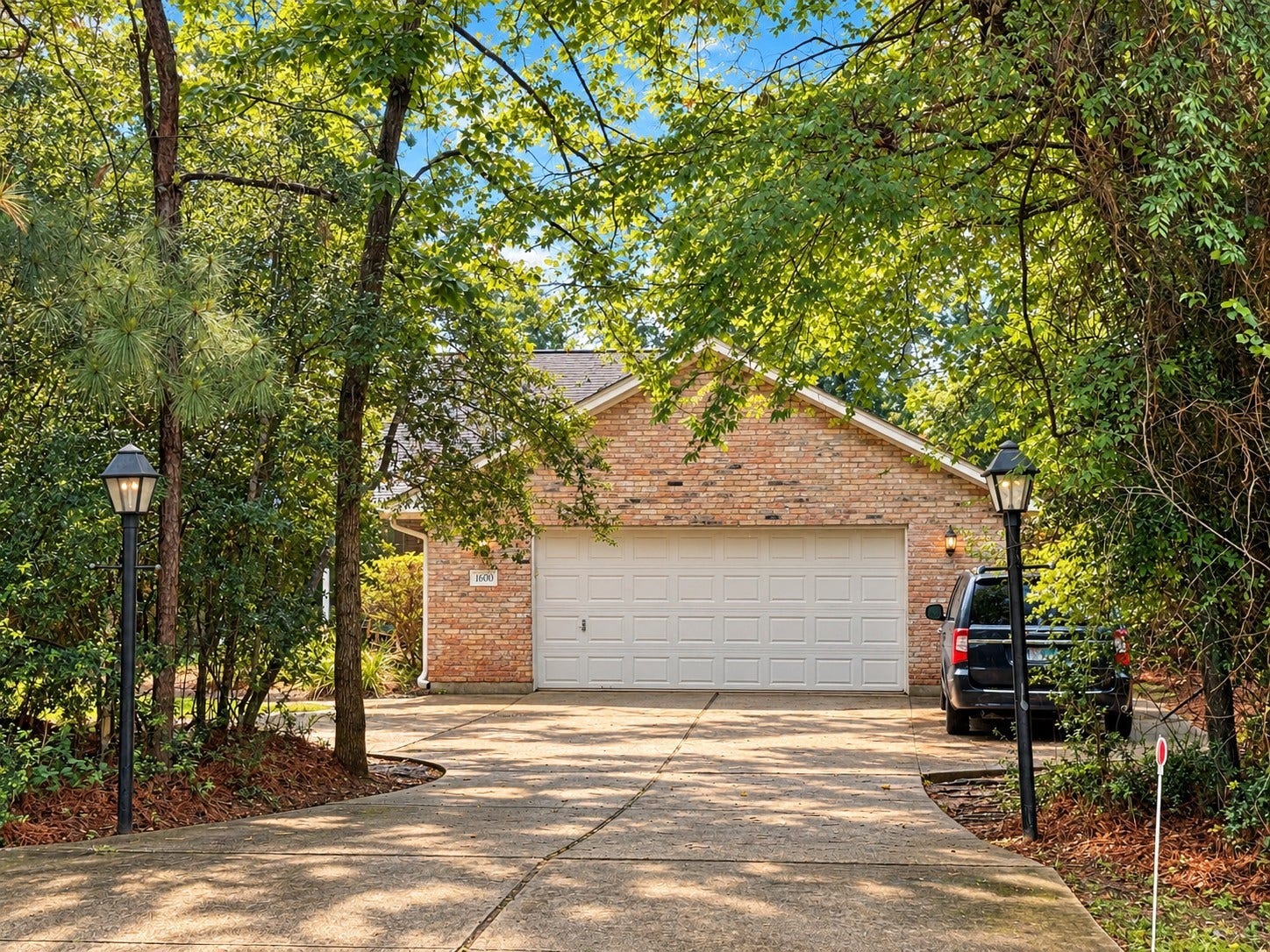 1600 Carriage Run W, Conroe, TX 77384 Plenty of Room for Parking & Storage! This spacious 2.5-car garage offers more than just parking, with a generous storage area at the front and a sunny window that welcomes natural light. Outside, the two-car driveway features a convenient turnaround area and additional side parking pad, providing ample space for guests and extra vehicles. A practical combination of storage, convenience, and flexibility!