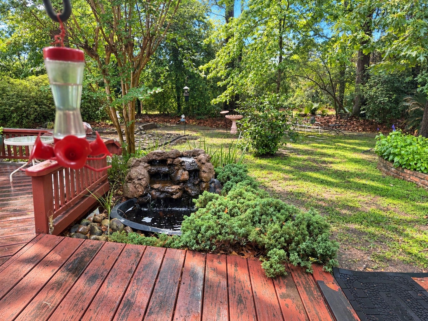 1600 Carriage Run W, Conroe, TX 77384 The Soothing Sounds of Nature! Escape the hustle and bustle of everyday life and enjoy the peaceful sounds of your very own bubbling waterfall pond. Towering mature trees create a beautiful natural backdrop, offering exceptional privacy and tranquil wooded views. Whether relaxing on the deck or simply enjoying the sights and sounds of nature, this enchanting backyard setting is a wonderful place to unwind!