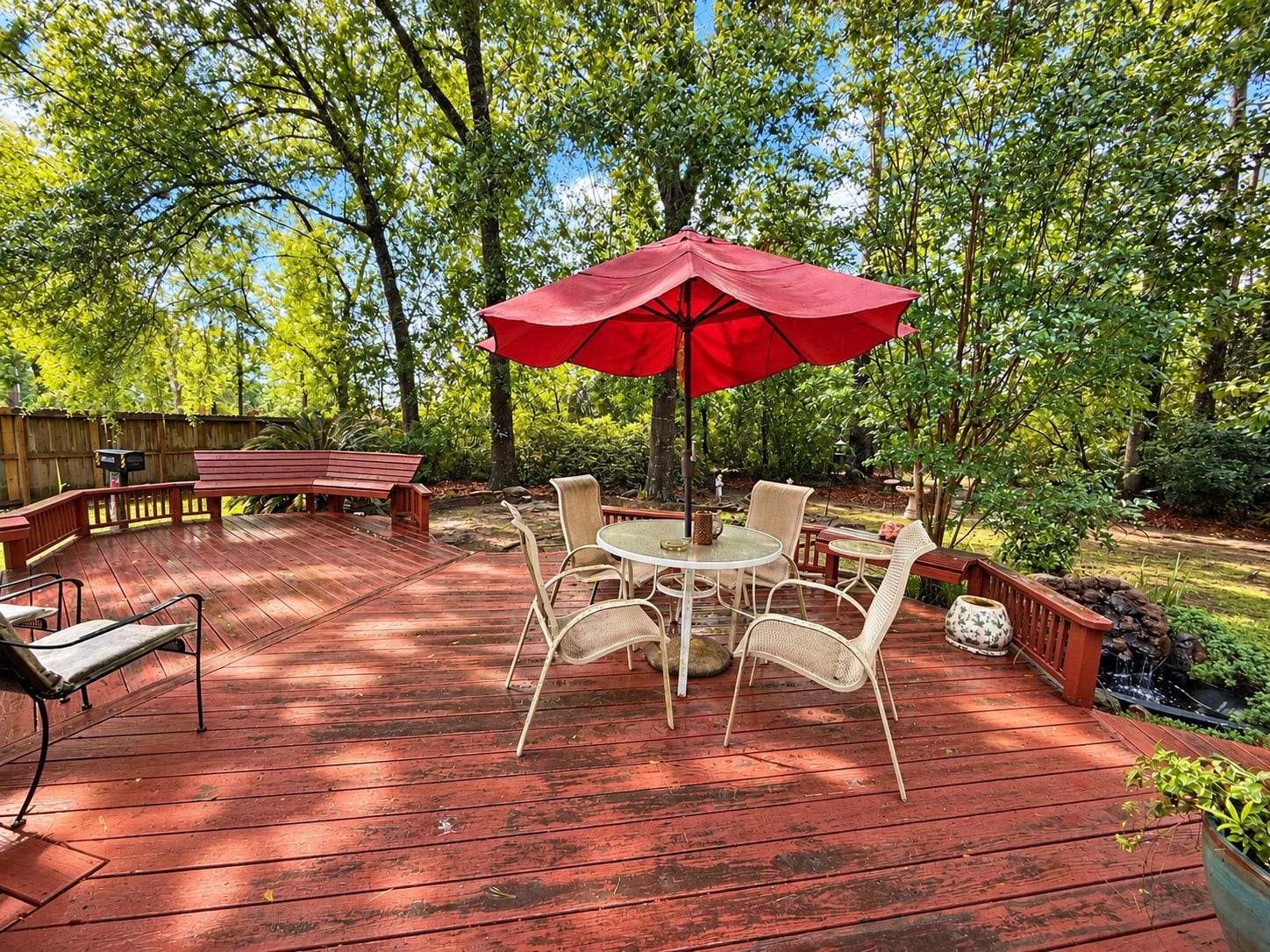 1600 Carriage Run W, Conroe, TX 77384 Your Own Private Backyard Escape! Surrounded by mature trees and lush natural beauty, this expansive backyard offers a wonderful sense of privacy and tranquility. The oversized deck has built-in seating and also provides plenty of room for both outdoor living and dining furniture, making it ideal for morning coffee, alfresco meals, or gathering with friends and family. Sit back, enjoy the peaceful wooded setting, and keep an eye out for deer wandering through the yard!
