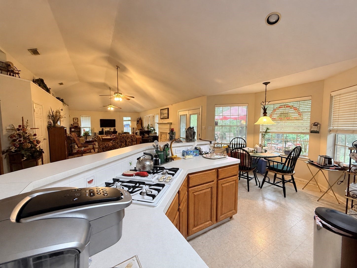 1600 Carriage Run W, Conroe, TX 77384 Open, Inviting & Perfect for Everyday Living! The kitchen features convenient breakfast bar seating and a sunny breakfast nook, offering wonderful options for casual dining. Open to the expansive family room, this welcoming layout keeps everyone connected, making it easy to enjoy conversations with family and friends while preparing meals or entertaining. A seamless flow that brings the home's living spaces together!