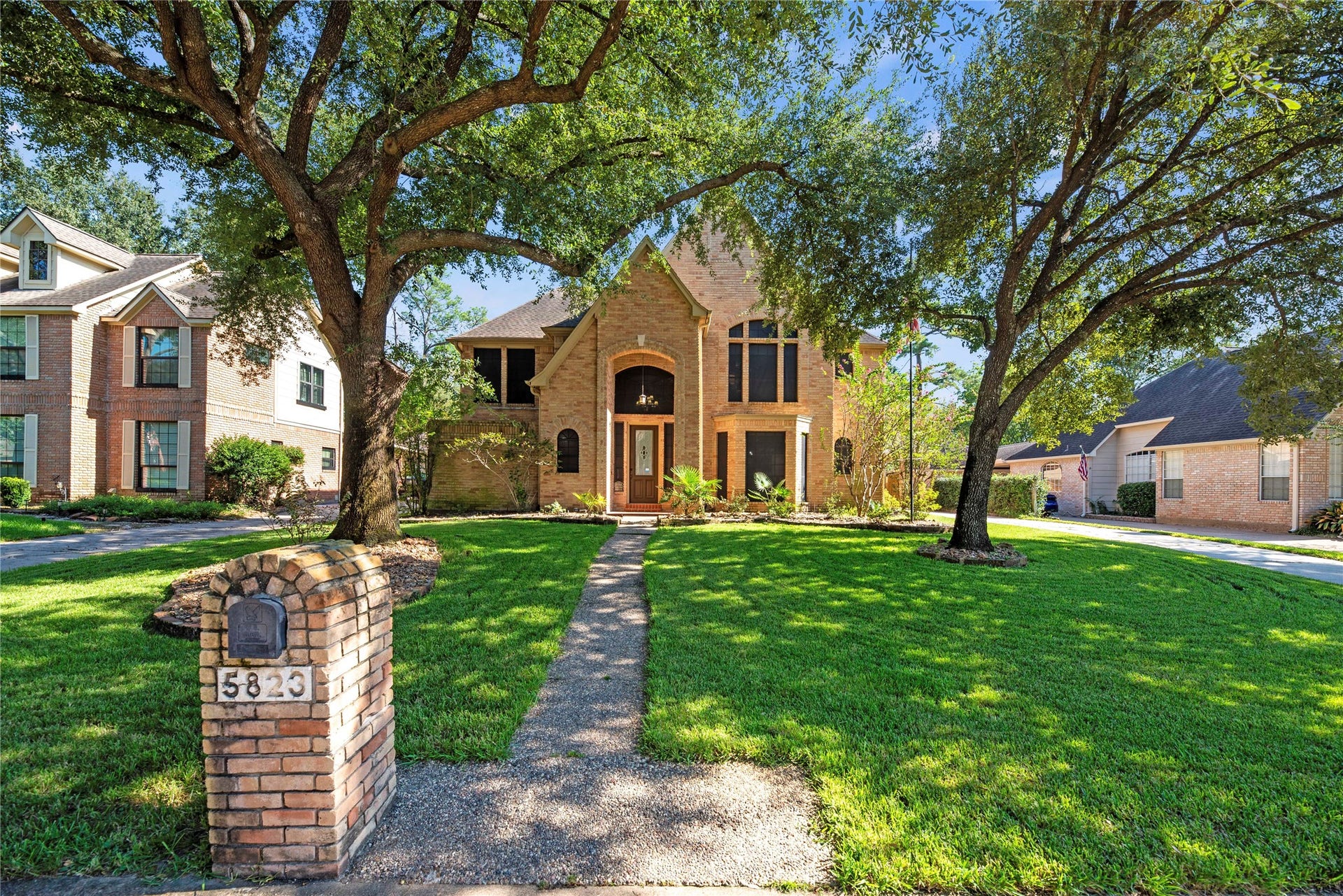 5823 Ashmere Lane, Spring, TX 77379 You're invited to come see what makes this home so special. Heated pool & spa, covered patio, generator, sprinkler, security system, soaring ceilings, hardwood floors & updated carpet, fireplace, wet bar, custom built-ins, island kitchen, formal dining, 1st floor primary suite, game room and more.