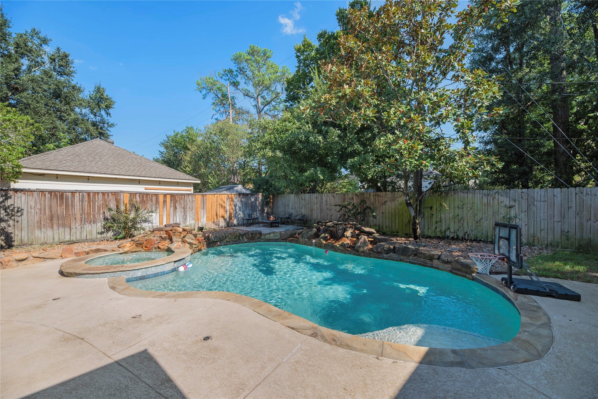 5823 Ashmere Lane, Spring, TX 77379 Your own backyard getaway is waiting! This heated pool and spa with a cascading rock waterfall offer the perfect excuse to spend more time outdoors. Whether you're cooling off on a sunny afternoon or relaxing in the spa, there's plenty to love about staying home.